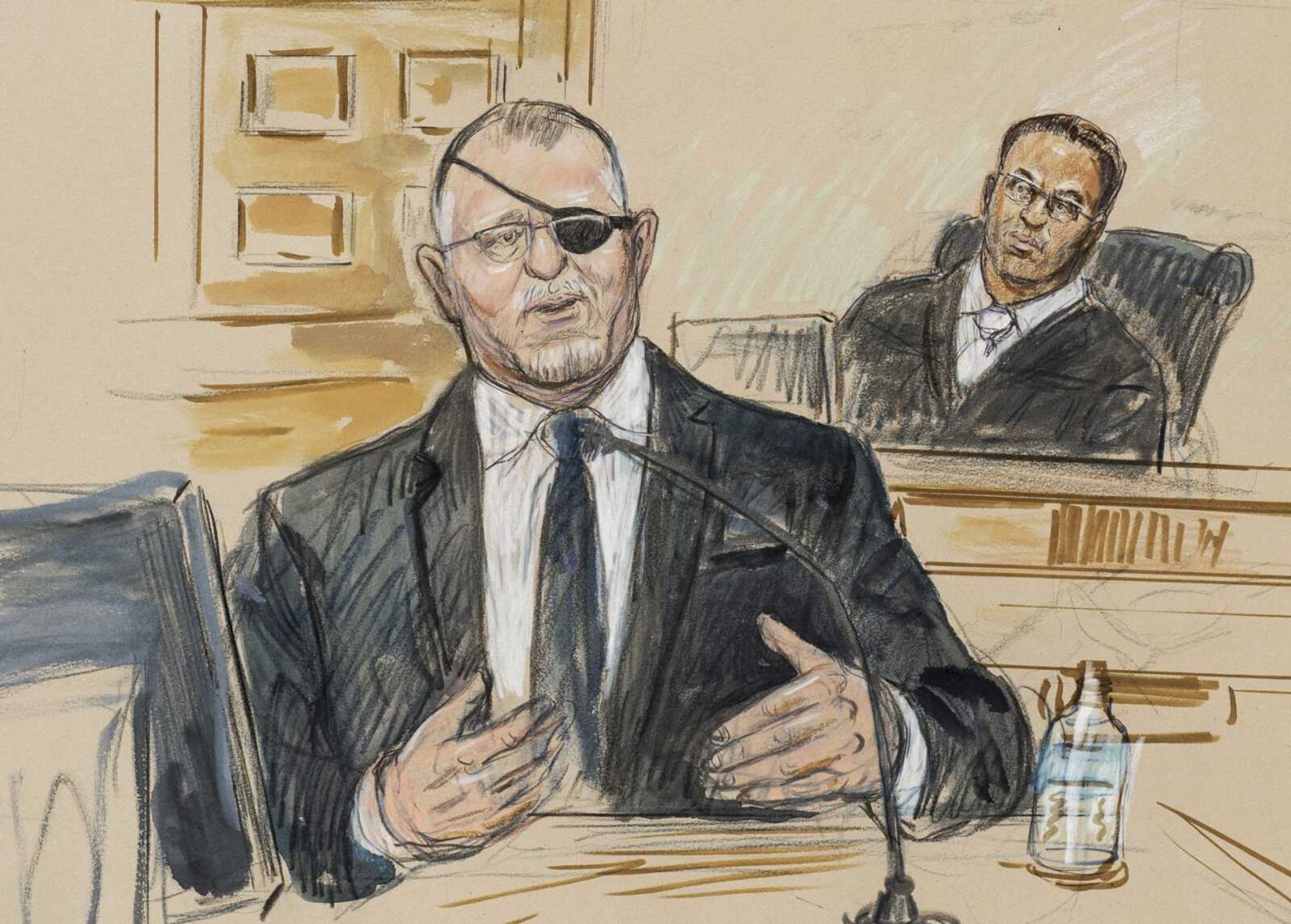 This artist sketch depicts the trial of Oath Keepers leader Stewart Rhodes, left, as he testifies before U.S. District Judge Amit Mehta on charges of seditious conspiracy in the Jan. 6, 2021, attack on the U.S. Capitol, on Nov. 7 in Washington, Nov. 7.