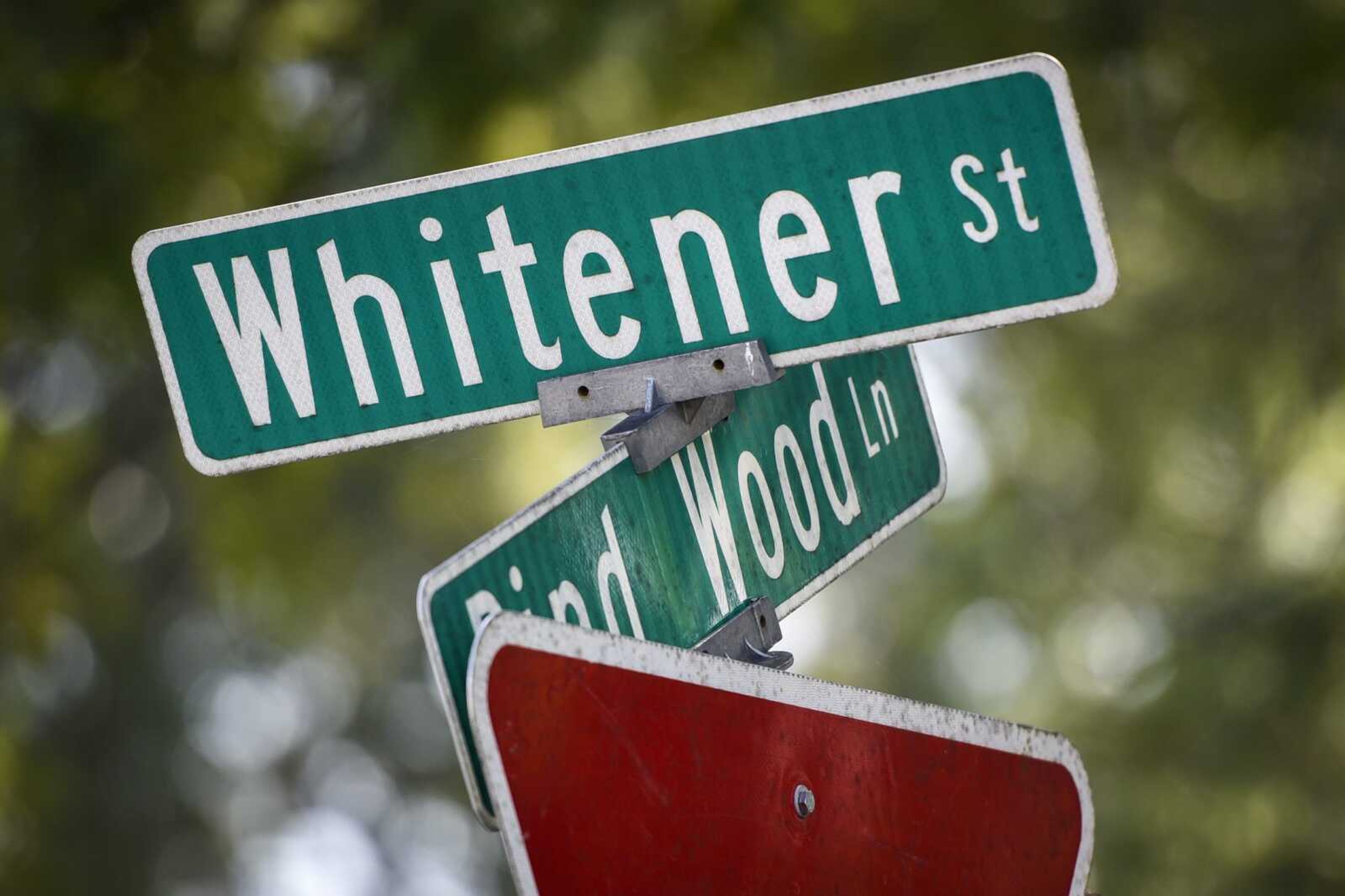 A street sign is seen Monday marking the intersection of Whitener Street and Pind Wood Lane in Cape Girardeau.