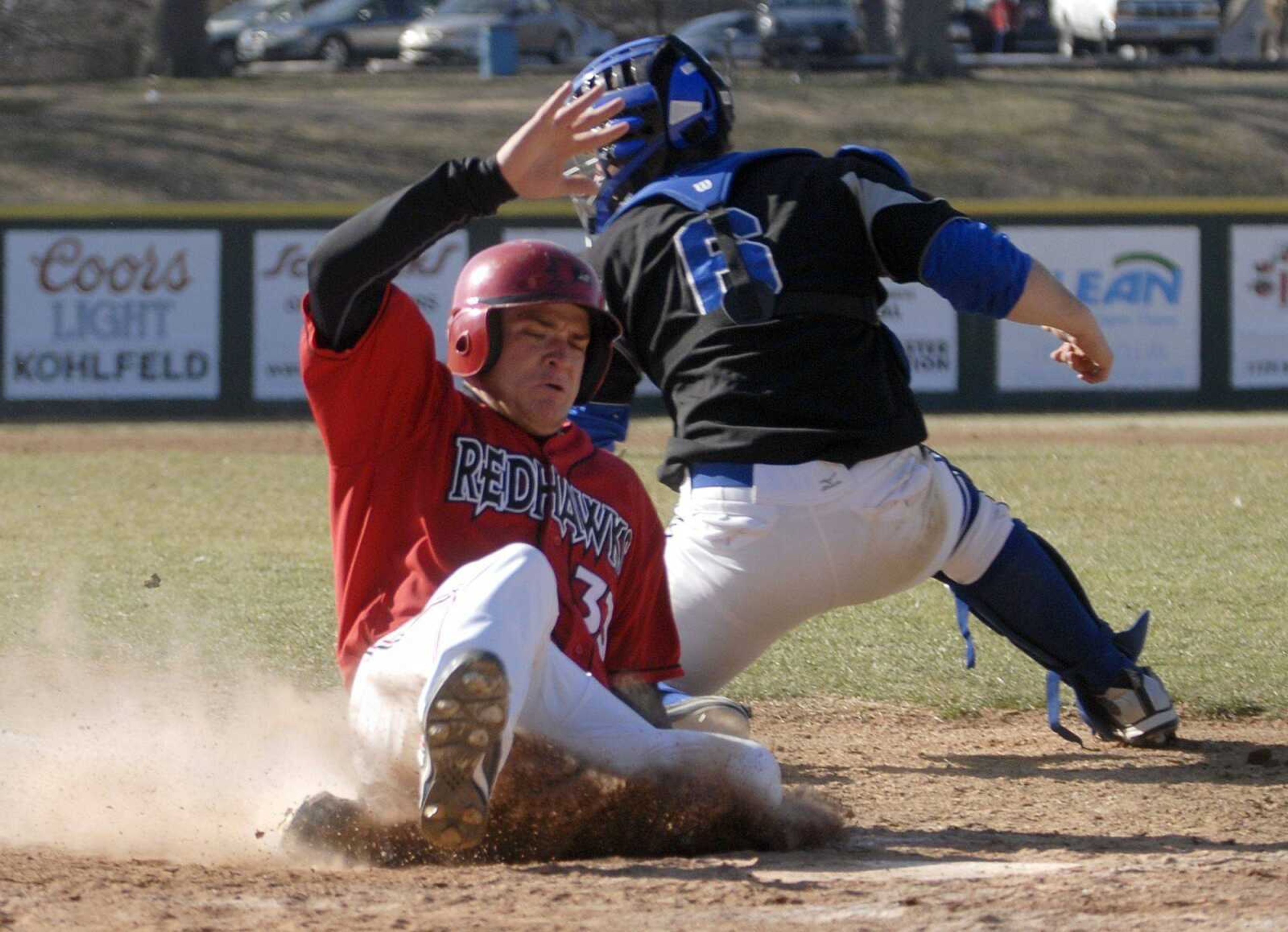 Southeast Missouri State's Louie Haseltine slides in for a run at the bottom of the sixth inning Sunday, February 28, 2010 as Southeast sweaps IPFW. (LAURA SIMON)