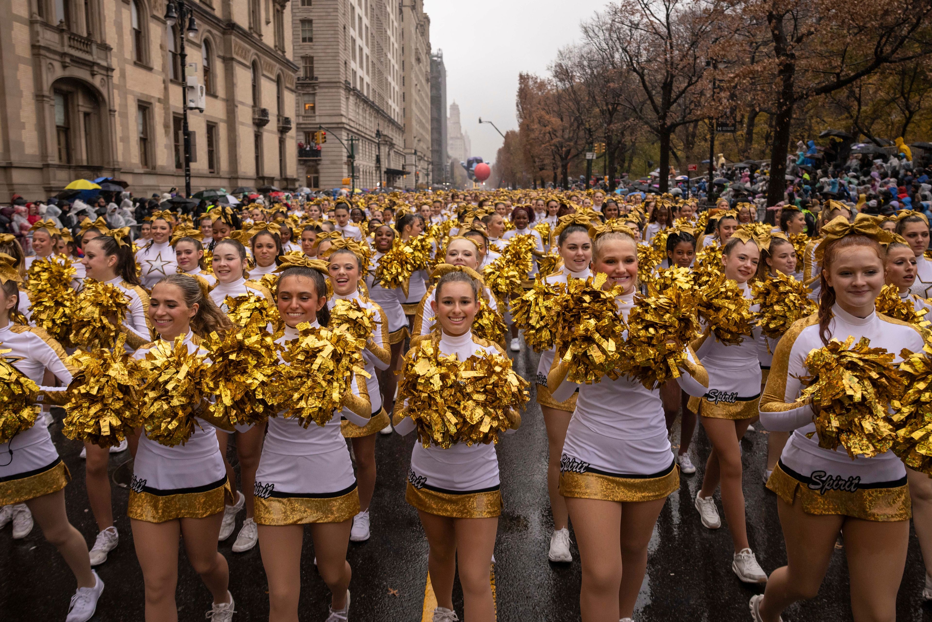 Parade performers march down Central Park West during the Macy's Thanksgiving Day parade, Thursday, Nov. 28 2024, in New York. (AP Photo/Yuki Iwamura)