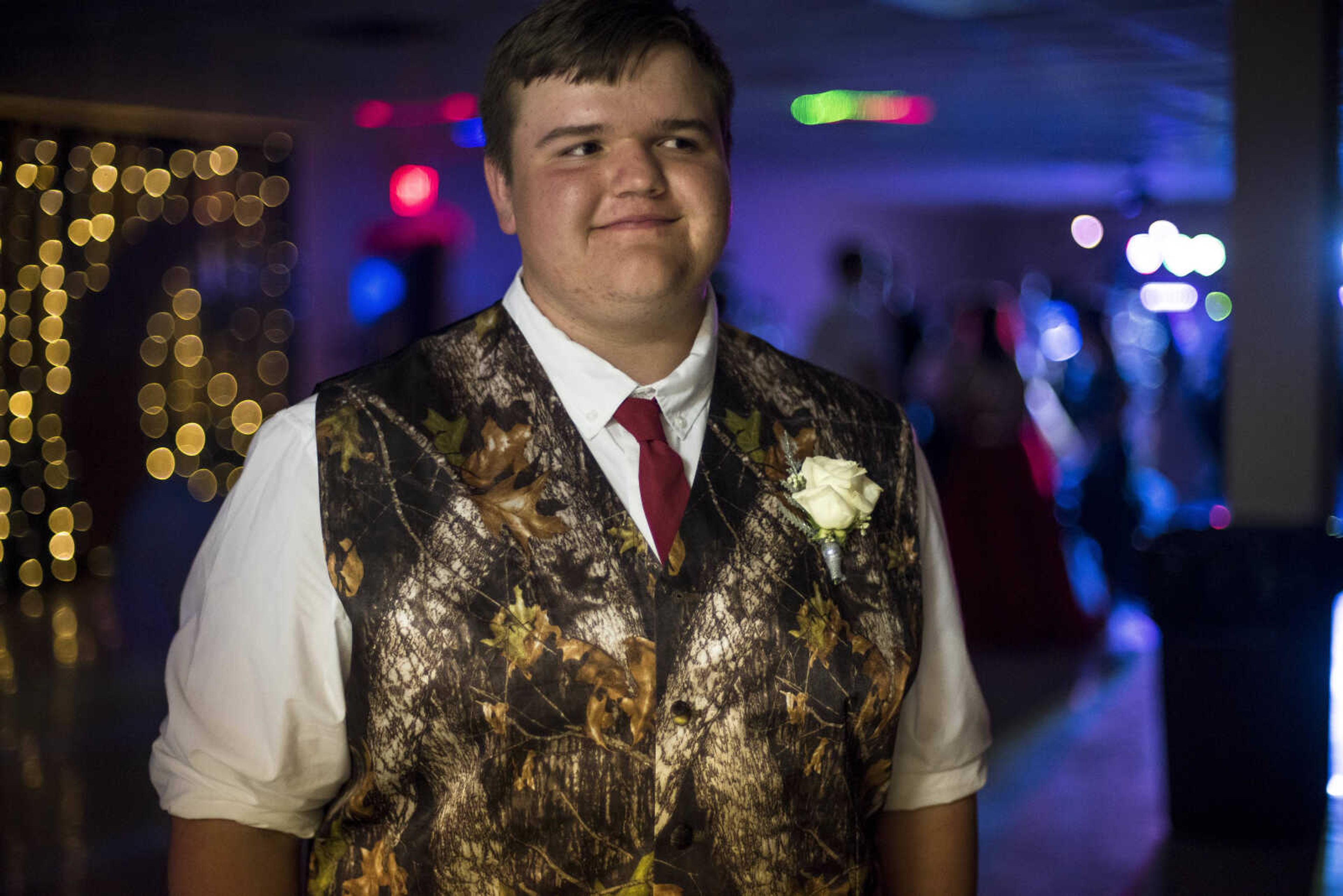 Trenton Beard, in a camo vest, poses for a portrait during the Oak Ridge Prom Saturday, April 13, 2019, at the Jackson Elks Lodge in Jackson.