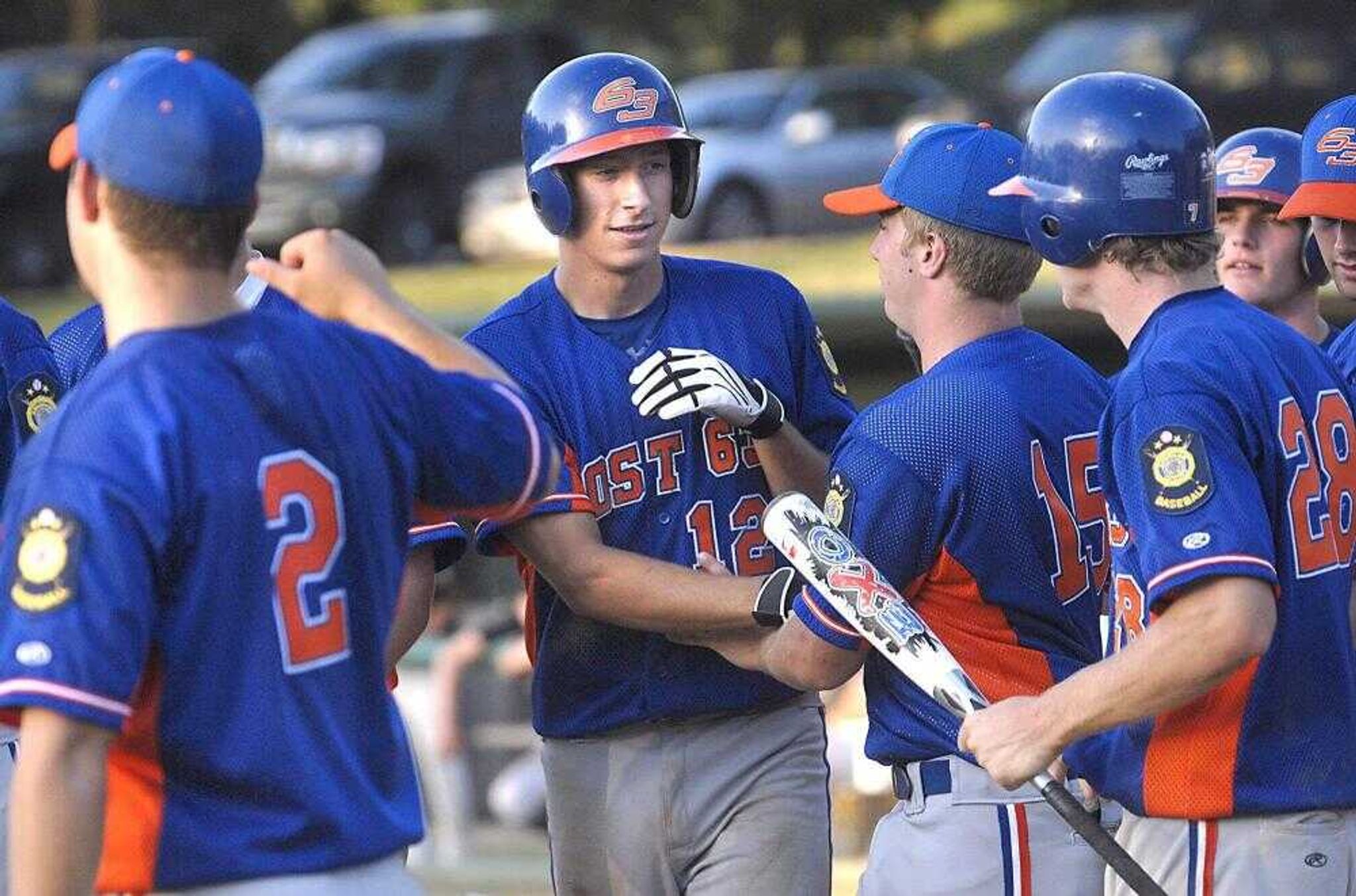 Blake Slattery was met by Cape Girardeau Ford &amp; Sons American Legion teammates after hitting a home run during the sixth inning of the first game against Dunklin County on Monday night at Capaha Field. (Fred Lynch)