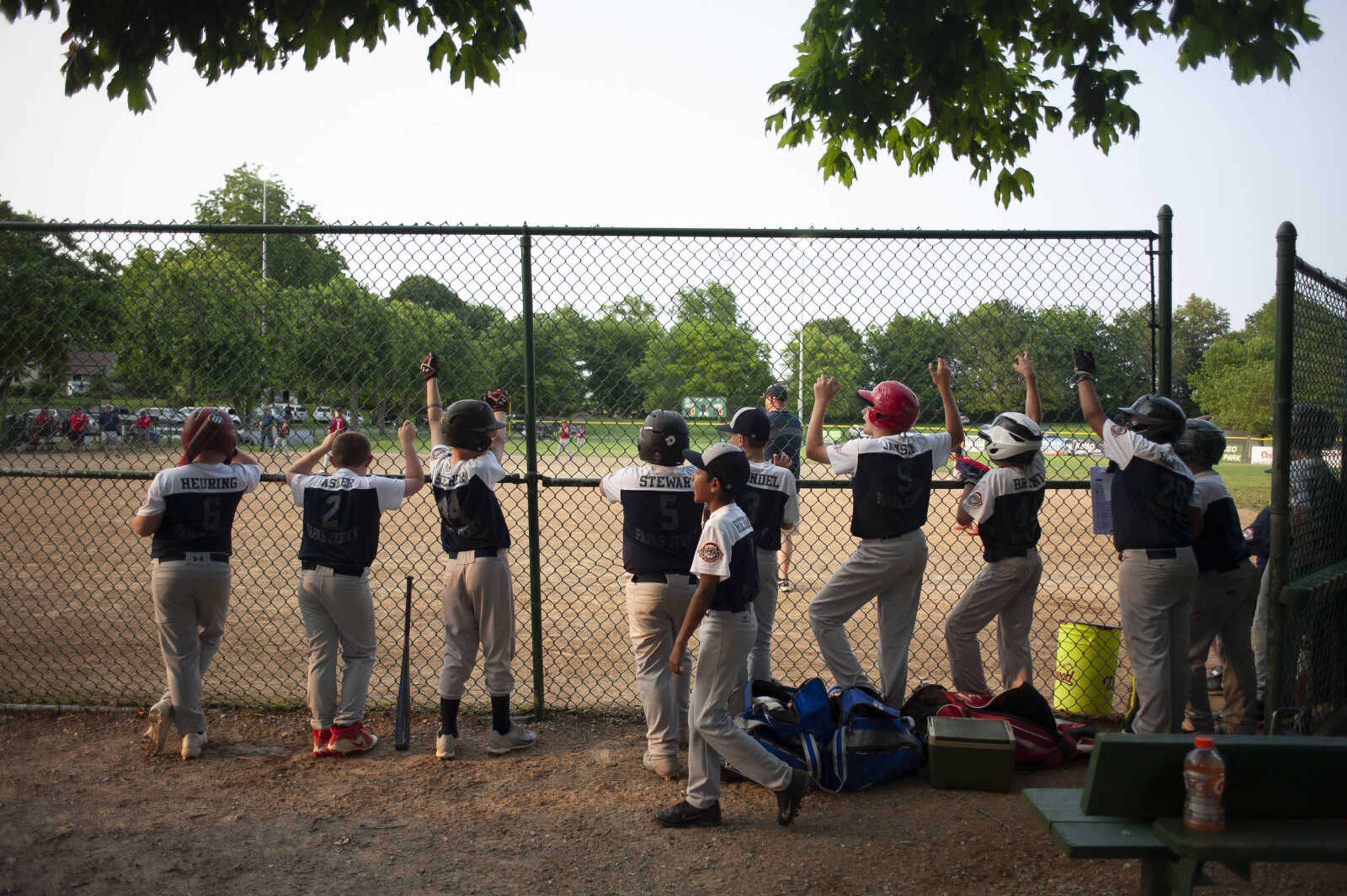 Scott County All-Stars line the fence to watch the game during the team's 5-2 victory over the SEMO Cardinals in the championship game of the 2019 Kelso 11U Showdown on Sunday, June 2, 2019, in Kelso.