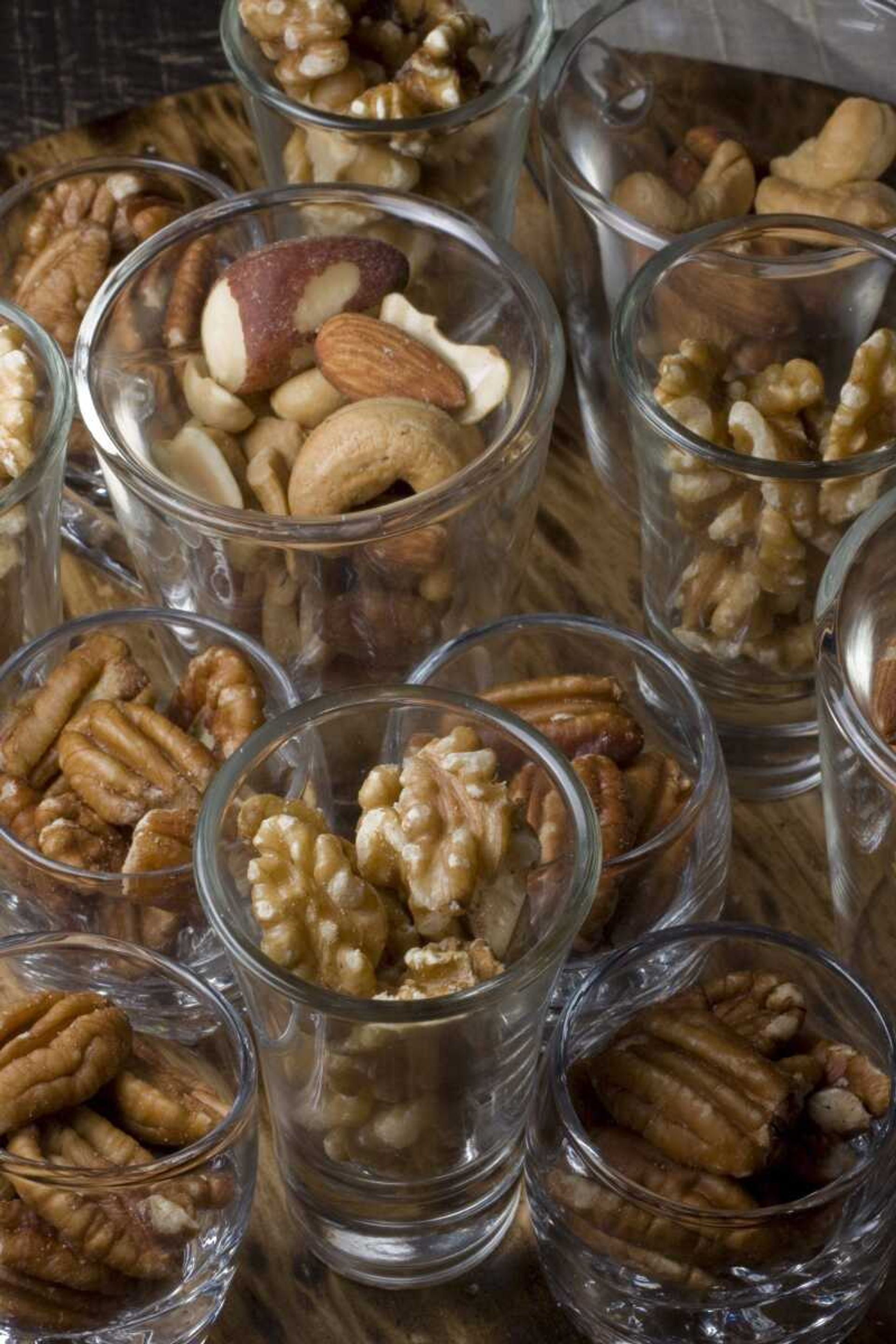 Avoid a big bowl of snacks for hand after hand to plunge into, opting instead for individual servings available in containers like espresso cups, shot glasses or any like sized containers.