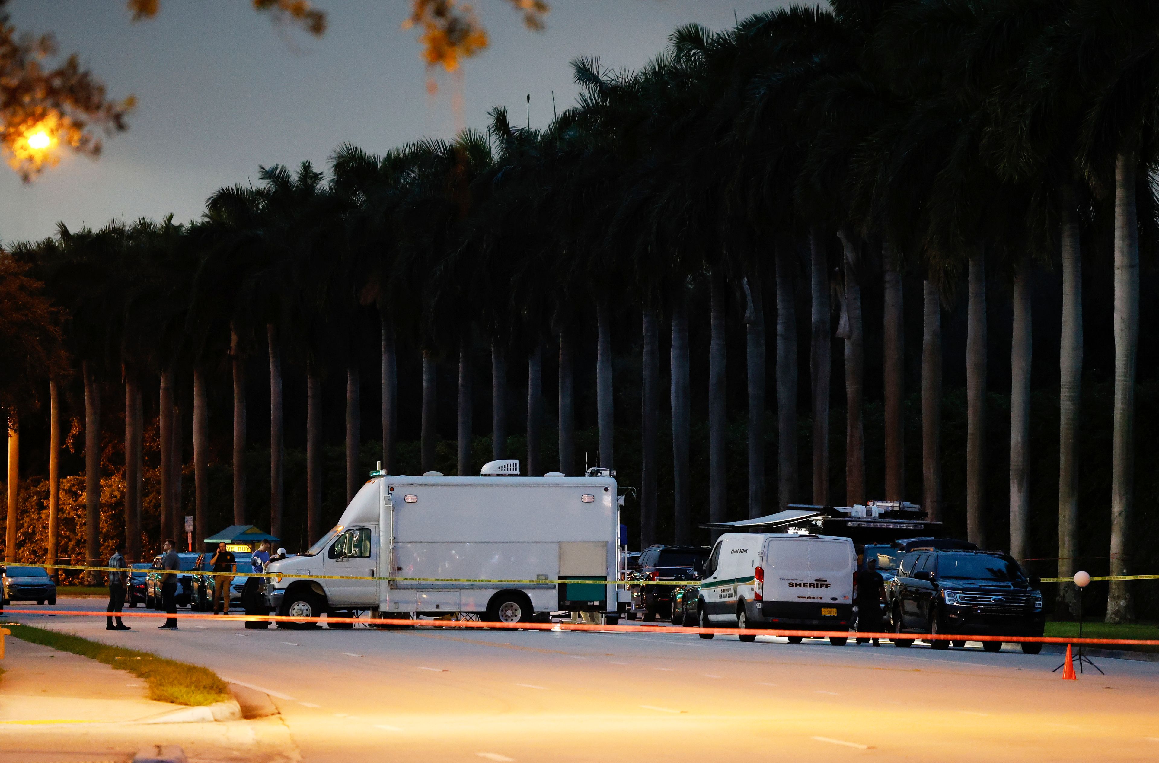 Police crime scene vehicles are seen at Trump International Golf Club after police closed off the area following the apparent assassination attempt of Republican presidential nominee former President Donald Trump in West Palm Beach, Fla., Sunday, Sept. 15, 2024. (AP Photo/Terry Renna)