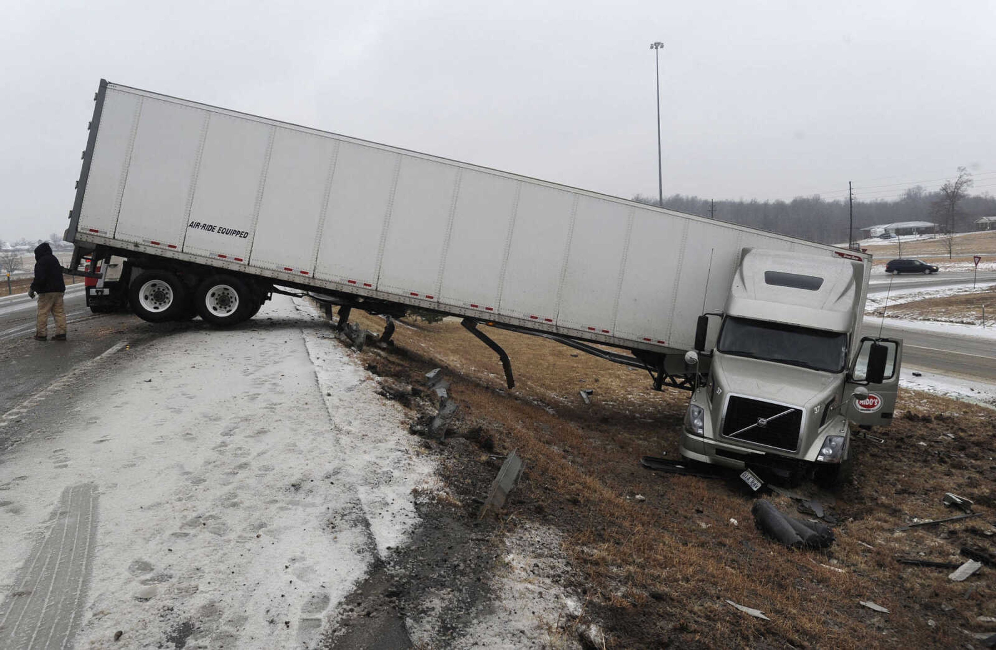 FRED LYNCH ~ flynch@semissourian.com
A tractor-trailer that slid off the southbound lanes of Interstate 55 came to rest near the off-ramp of Center Junction near mile marker 100 on Tuesday, Feb. 4, 2014. The wreck took out a portion of the guard rail.