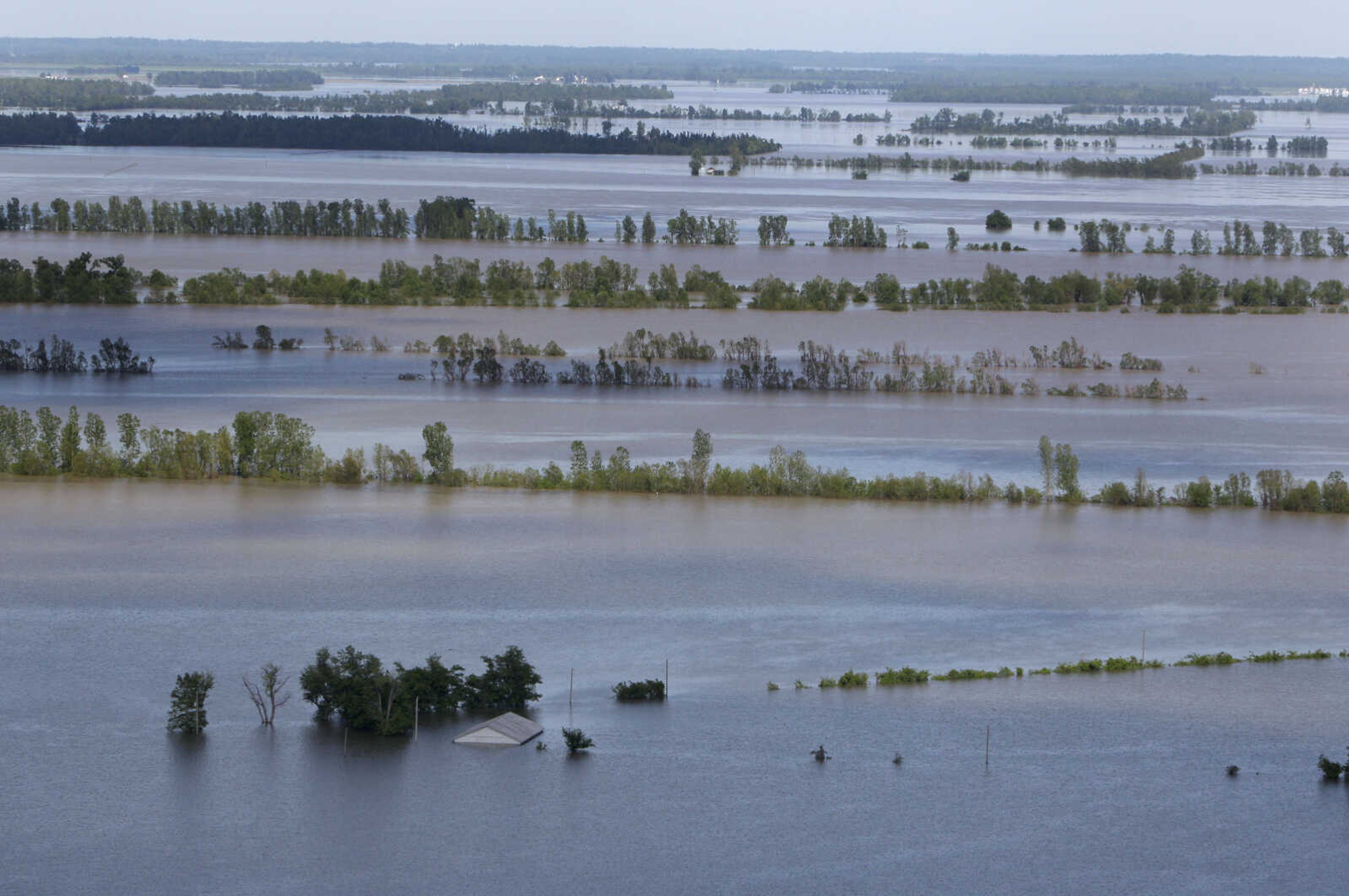 A structure is seen nearly covered by floodwater from the Mississippi River, Tuesday, May 3, 2011, north of New Madrid, Mo.  Many areas along the river in Missouri's bootheel are seeing significant flooding and ominous flooding forecasts are raising alarm from southeast Missouri to Louisiana and Mississippi. (AP Photo/Jeff Roberson)