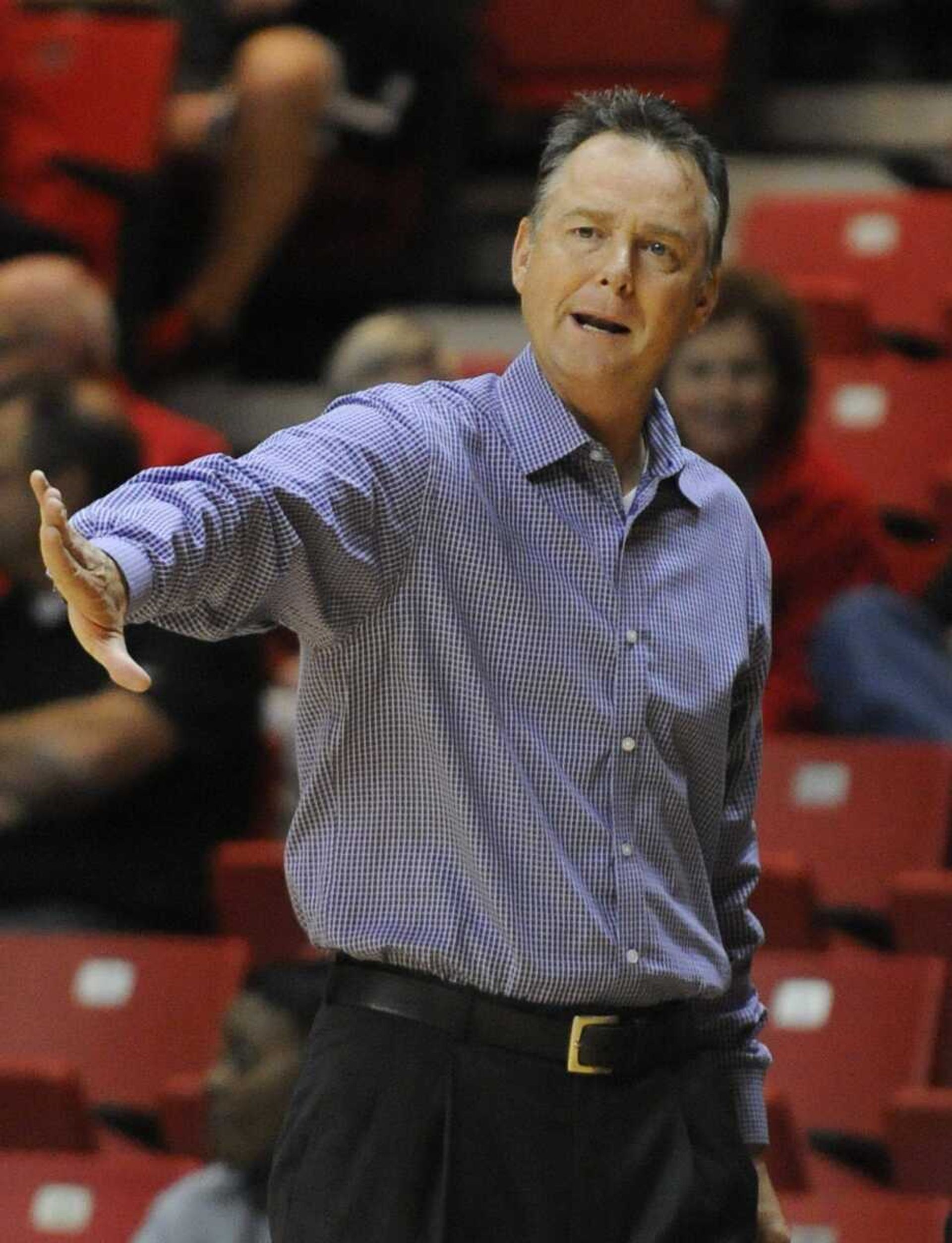 Ouachita Baptist head coach Dennis Nutt gives instructions to his players during the Tiger' 71-60 loss to the Southeast Missouri State Redhawks' , coached by his brother Dickie,Tuesday, October 30, at the Show Me Center. (ADAM VOGLER)