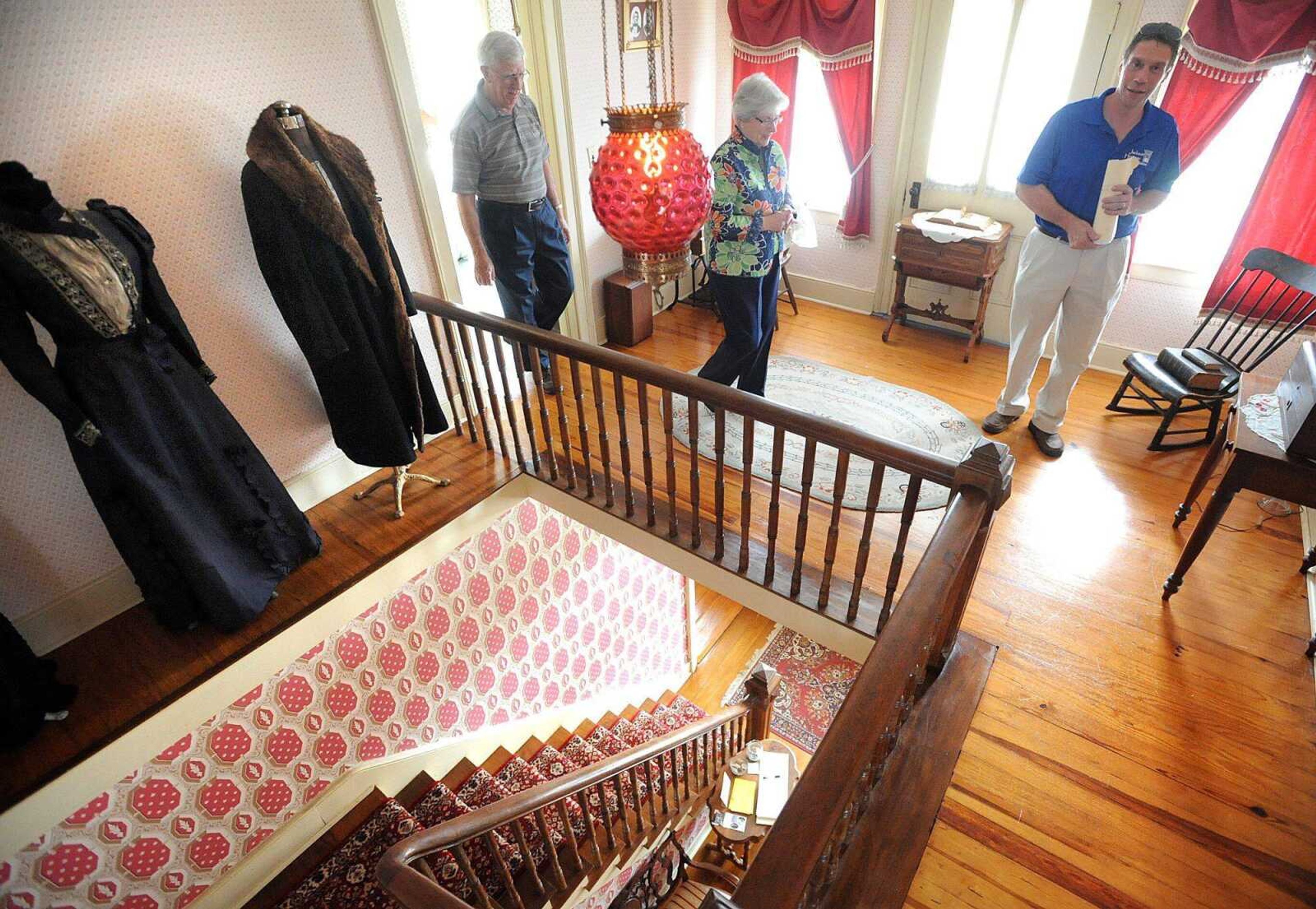 Pat Fosse with the Jackson Heritage Association leads Martha and Ralph Maxton to the staircase of the Oliver House to continue their tour downstairs Sunday, April 7, 2013 in Jackson. (Laura Simon)