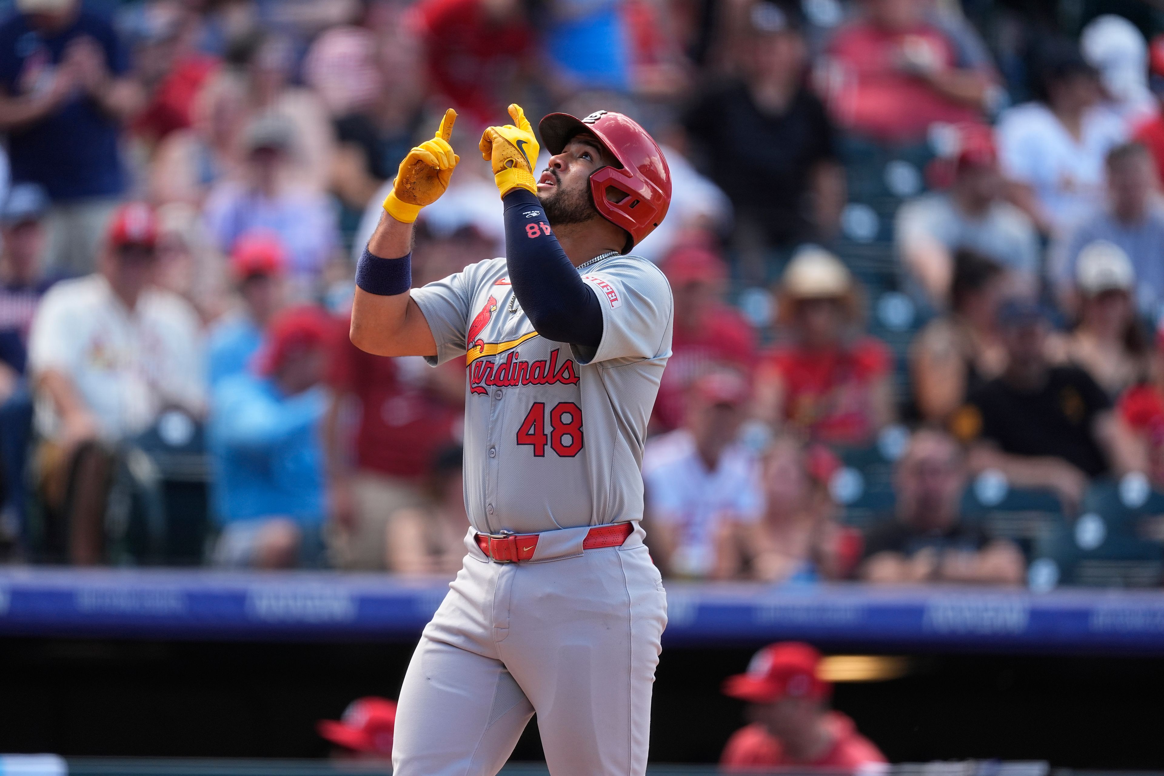 St. Louis Cardinals' Iván Herrera gestures as he crosses home plate after hitting a solo home run off Colorado Rockies starting pitcher Kyle Freeland in the fifth inning of a baseball game Thursday, Sept. 26, 2024, in Denver. (AP Photo/David Zalubowski)