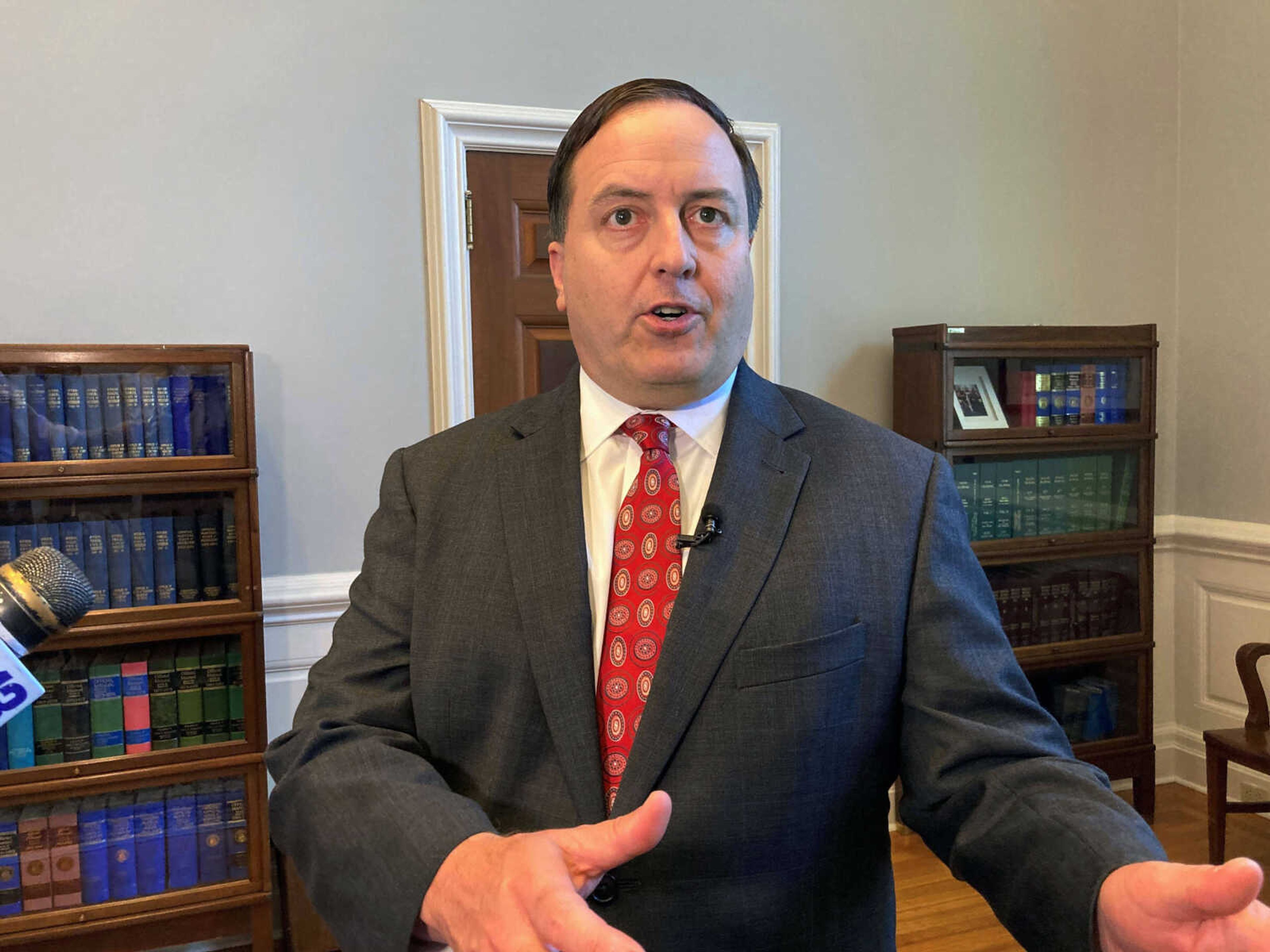 Missouri Secretary of State Jay Ashcroft speaks to reporters on Wednesday, June 29, 2022, at his Capitol office in Jefferson City, Mo. Ashcroft supported legislation signed into law by Gov. Mike Parson that will require a photo identification to cast a regular ballot. (AP Photo/David A. Lieb)