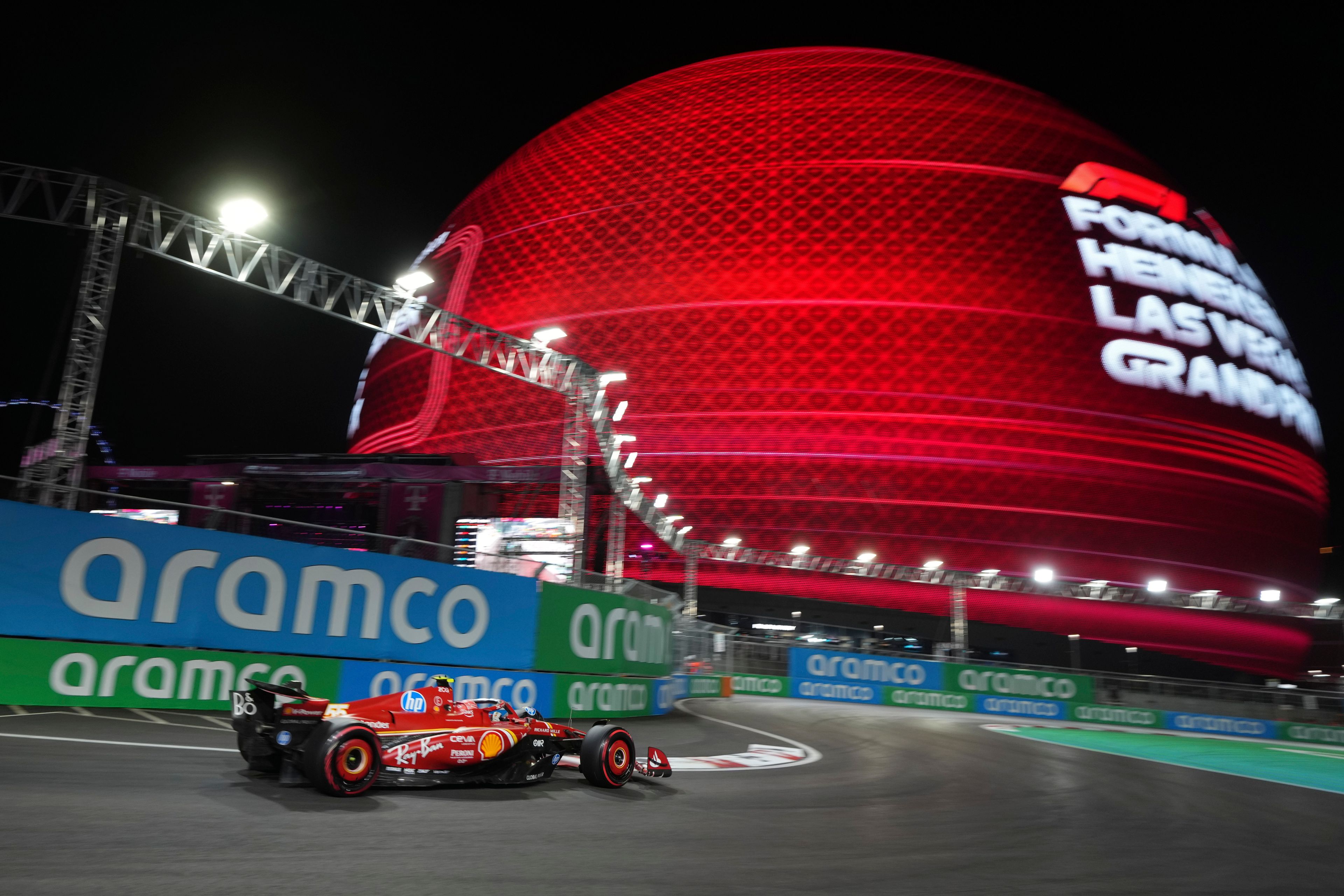 Ferrari driver Carlos Sainz, of Spain, drives during qualifications for the Formula One U.S. Grand Prix auto race, Friday, Nov. 22, 2024, in Las Vegas. (AP Photo/Rick Scuteri)