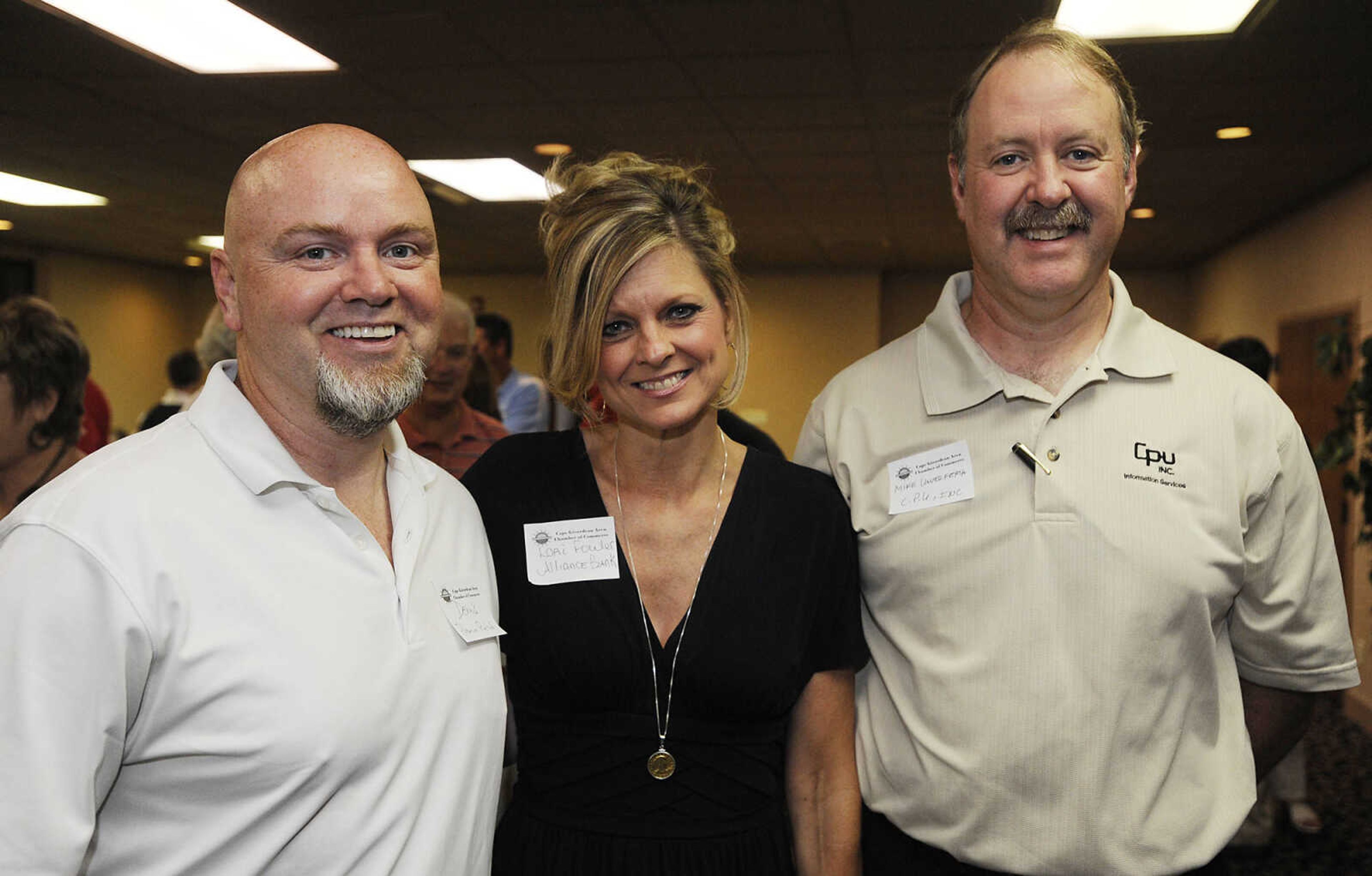 Dennis Sanders, left, Lori Fowler and Mike Unverferth at the Cape Girardeau Area Chamber of Commerce Business After Hours Tuesday, August 21, at Ray's Plaza Conference Center, 3257 William St.