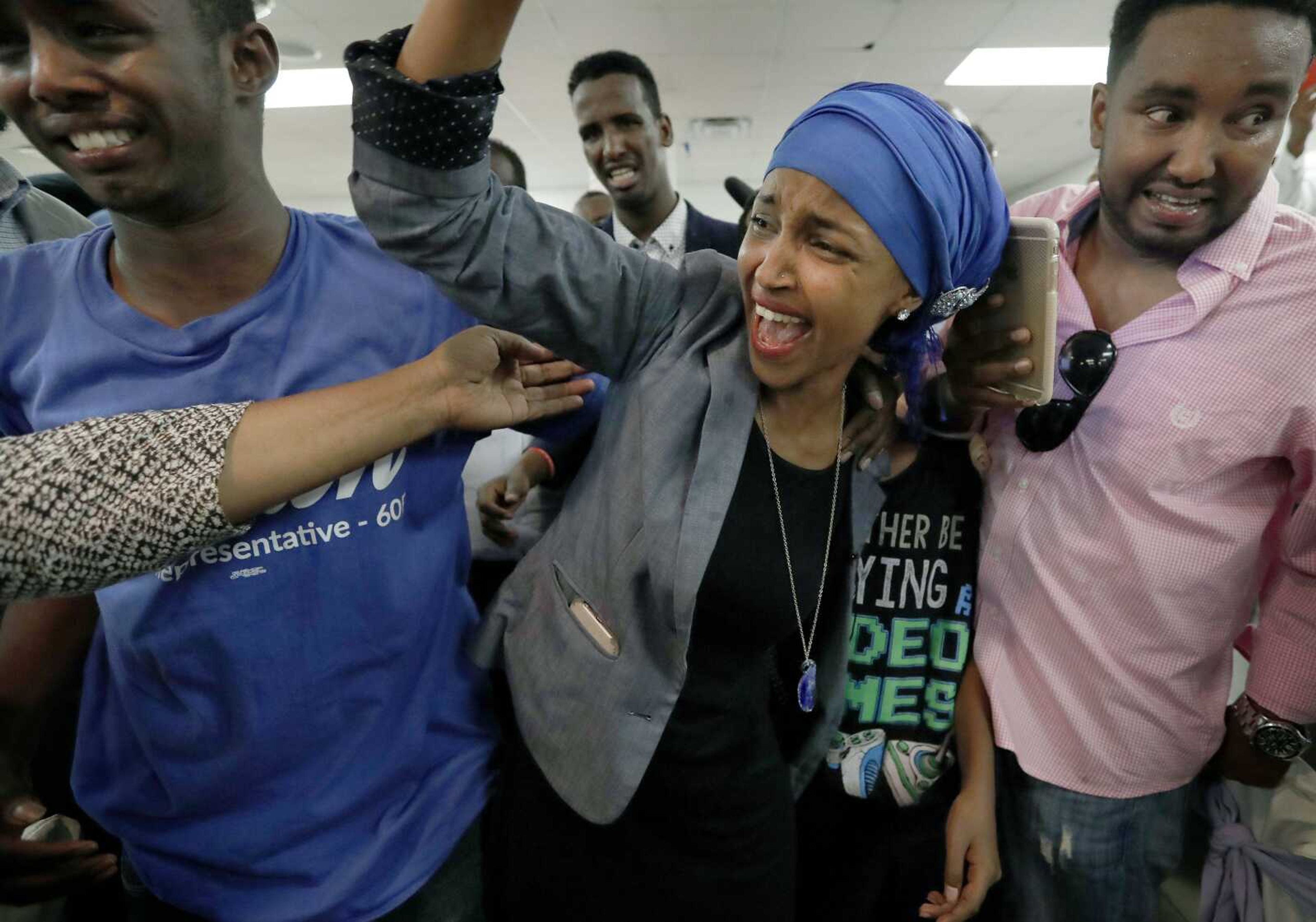 Somali activist Ilhan Omar is greeted by supporters Tuesday in Minneapolis. Omar defeated 22-term Rep. Phyllis Kahn in Tuesday's nominating contest in the heavily Democratic Minneapolis district.