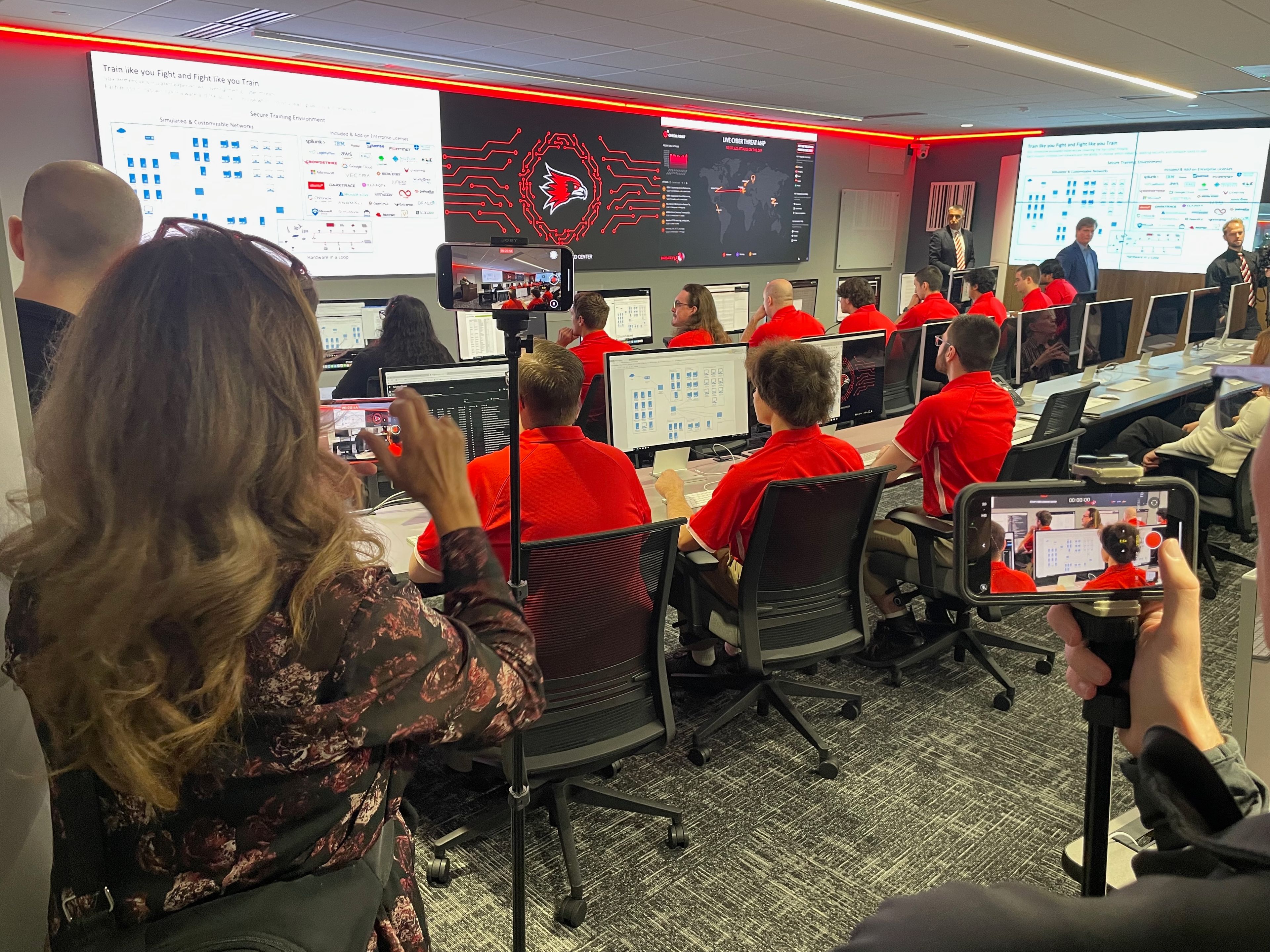 Observers look over the shoulders of the Southeast Missouri State University Cyber Defense Team as they prepare to stop a threat in a real-world simulation. The center is named after 1971 SEMO graduate Charles Stamp, who recently gifted the university $1 million toward the completion of the facility
