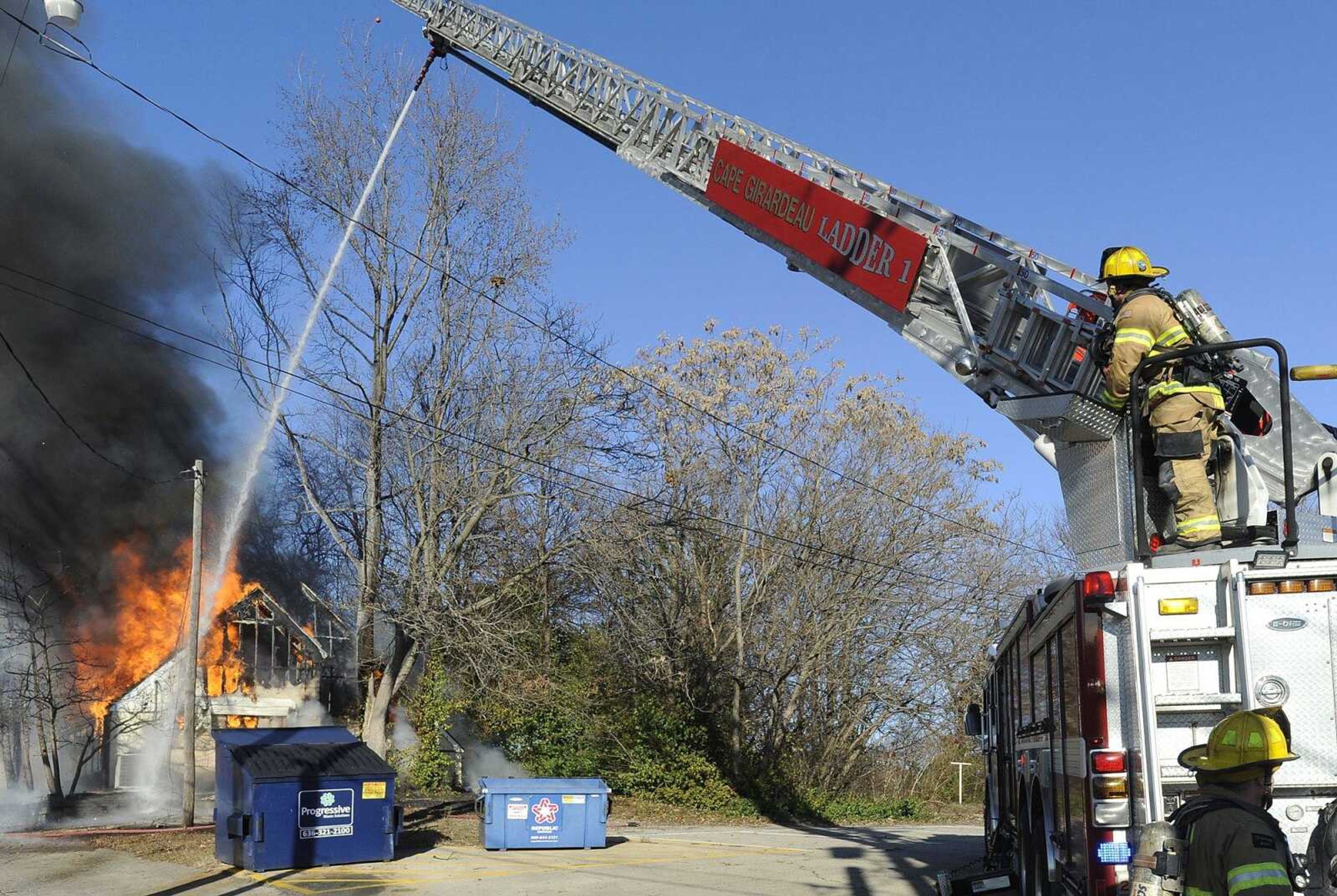 Cape Girardeau firefighters begin an aerial attack at a fire Sunday afternoon at the banquet hall of Celebrations Restaurant and Bar, 615 Bellevue St. in Cape Girardeau. (Fred Lynch)