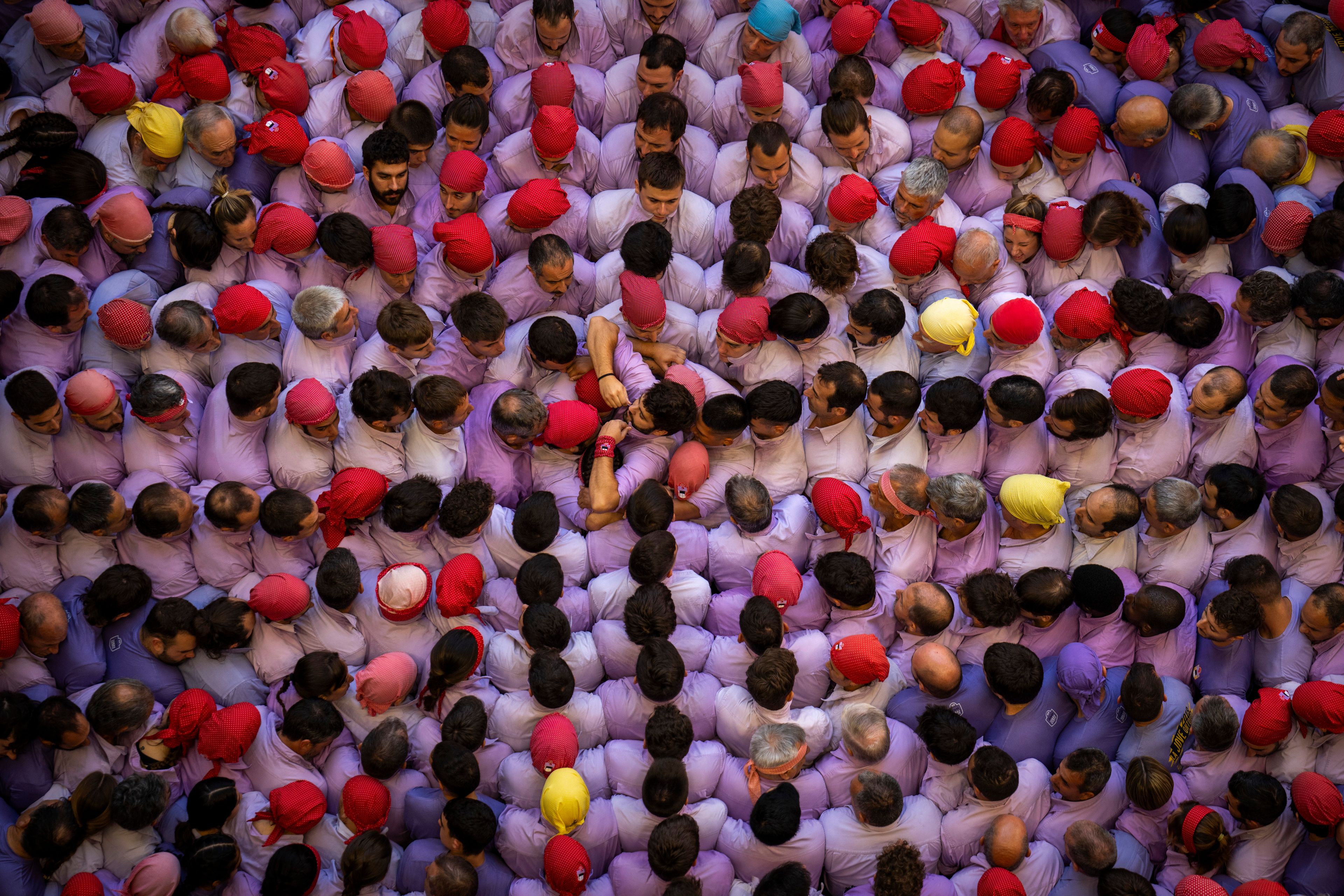 Members of "Colla Jove de Tarragona" form a "Castell" or human tower, during the 29th Human Tower Competition in Tarragona, Spain, Sunday, Oct. 6, 2024. (AP Photo/Emilio Morenatti)