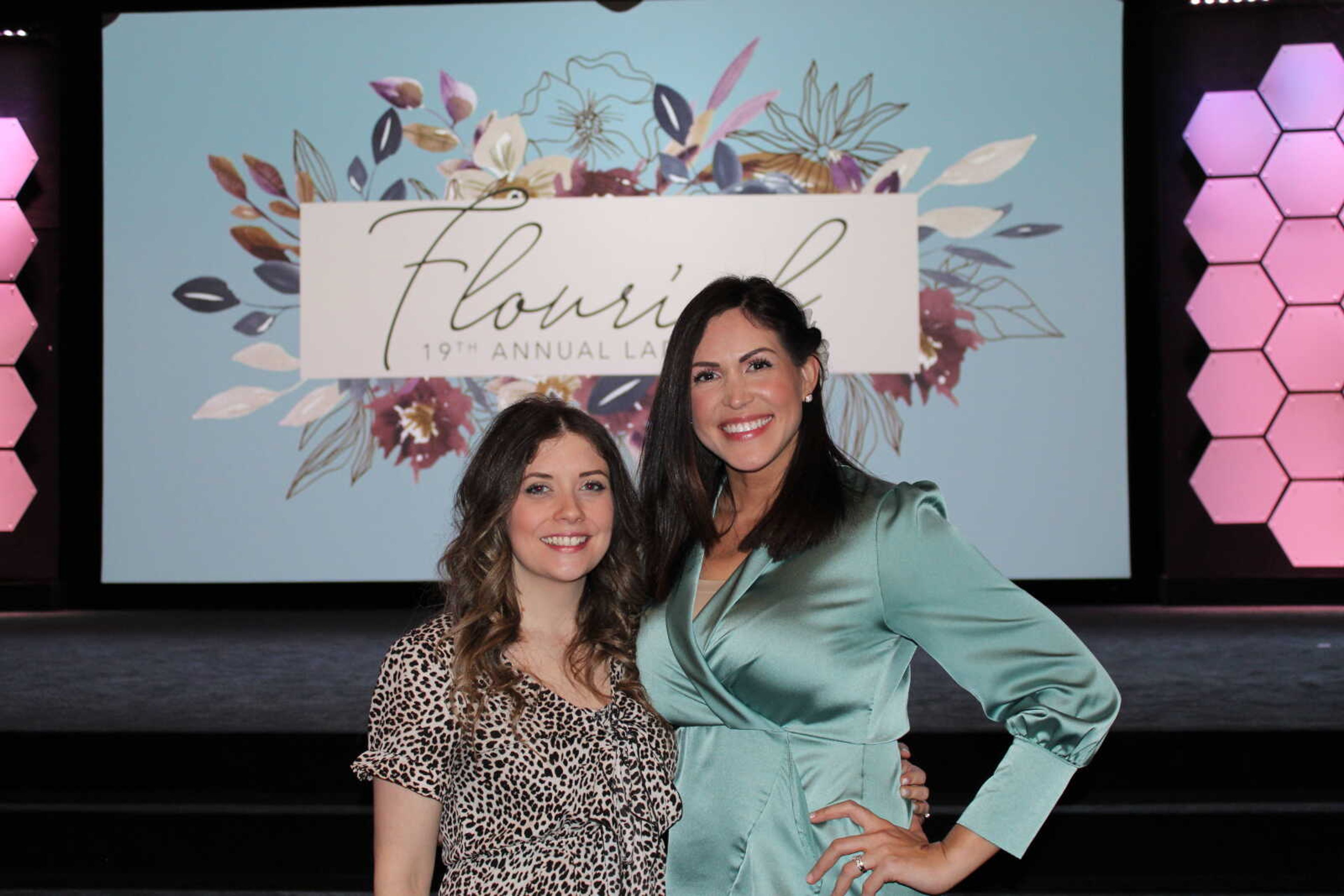 Katie Armmon and lead pastor Monica Fisher pose together before the event starts.