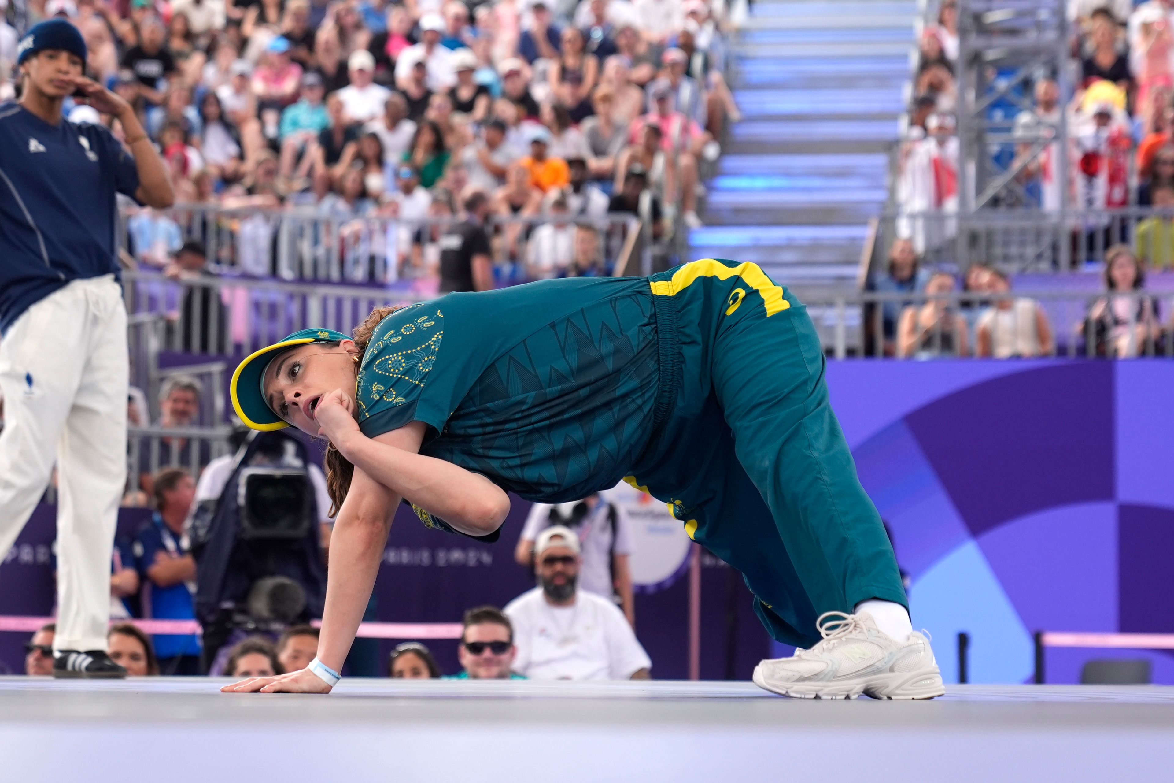 Australia's Rachael Gunn, known as B-Girl Raygun, competes during the Round Robin Battle at the breaking competition at La Concorde Urban Park at the 2024 Summer Olympics, Friday, Aug. 9, 2024, in Paris, France. (AP Photo/Frank Franklin)