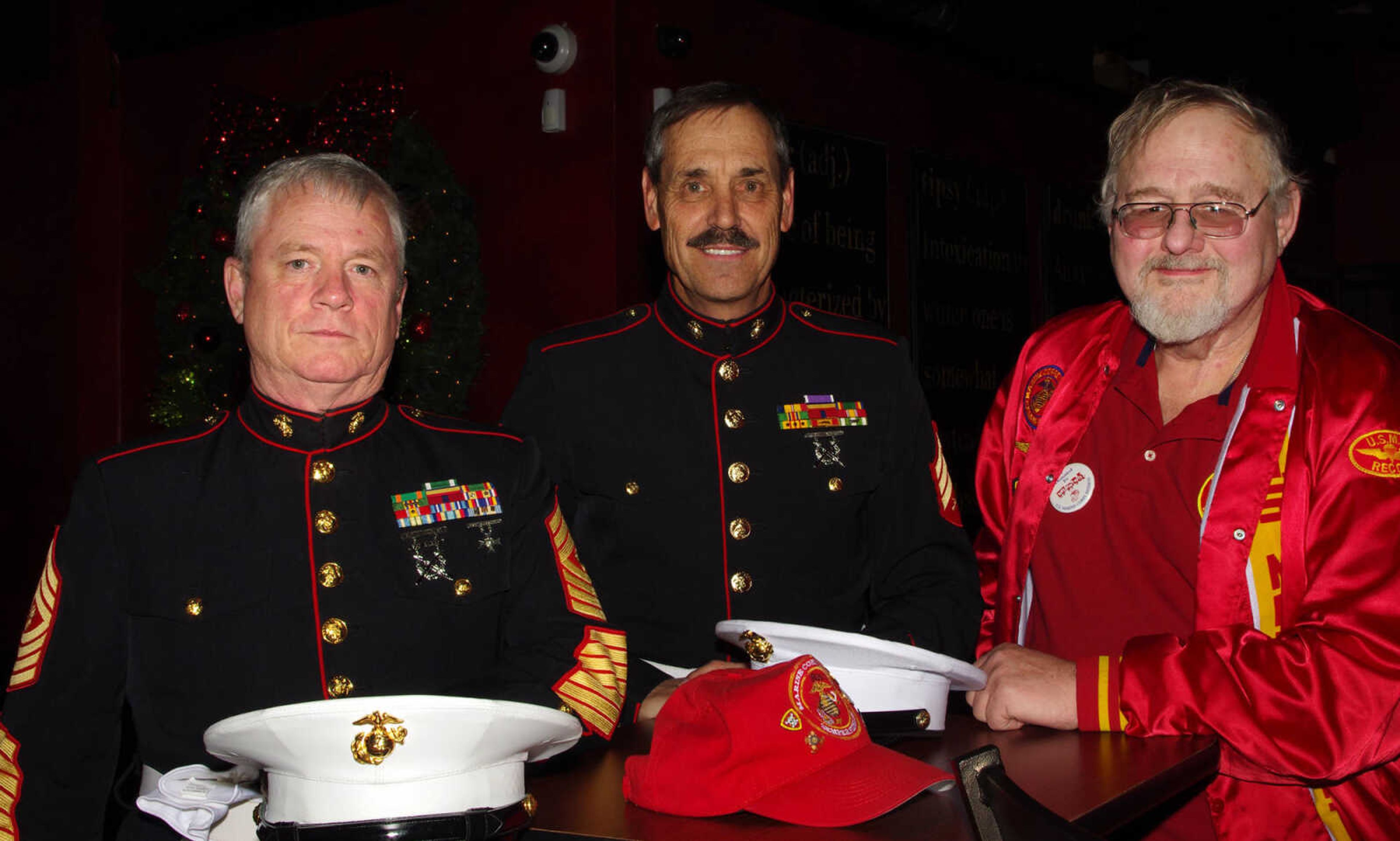 Ralph Craig, left, Richard Bollwerk and Steve Seyller with the Marine Corps League are helping with the Marine Toys for Tots Campaign.