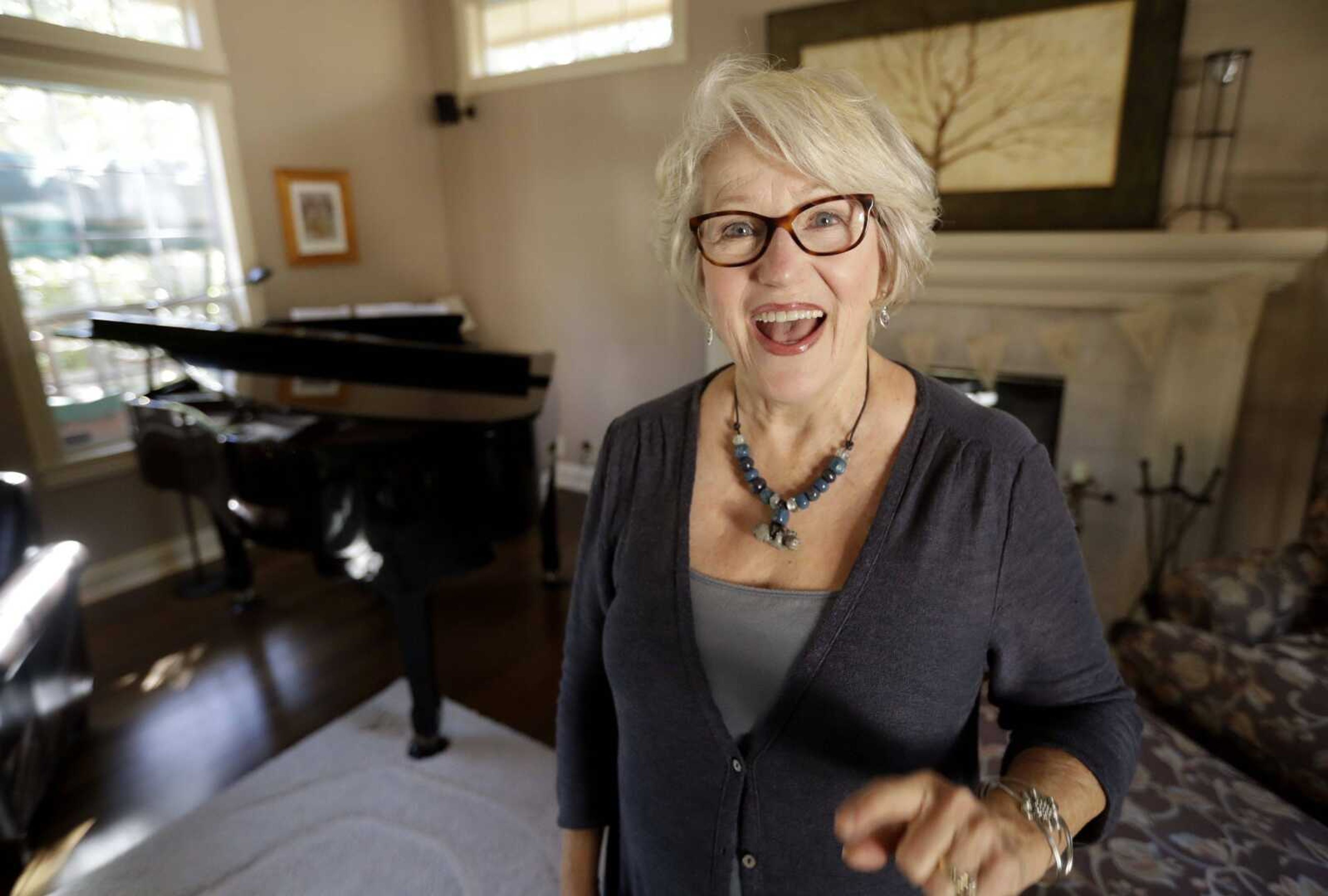 Gayla Peevey, singer of "I Want a Hippopotamus For Christmas," sings in her home Wednesday in La Mesa, California.