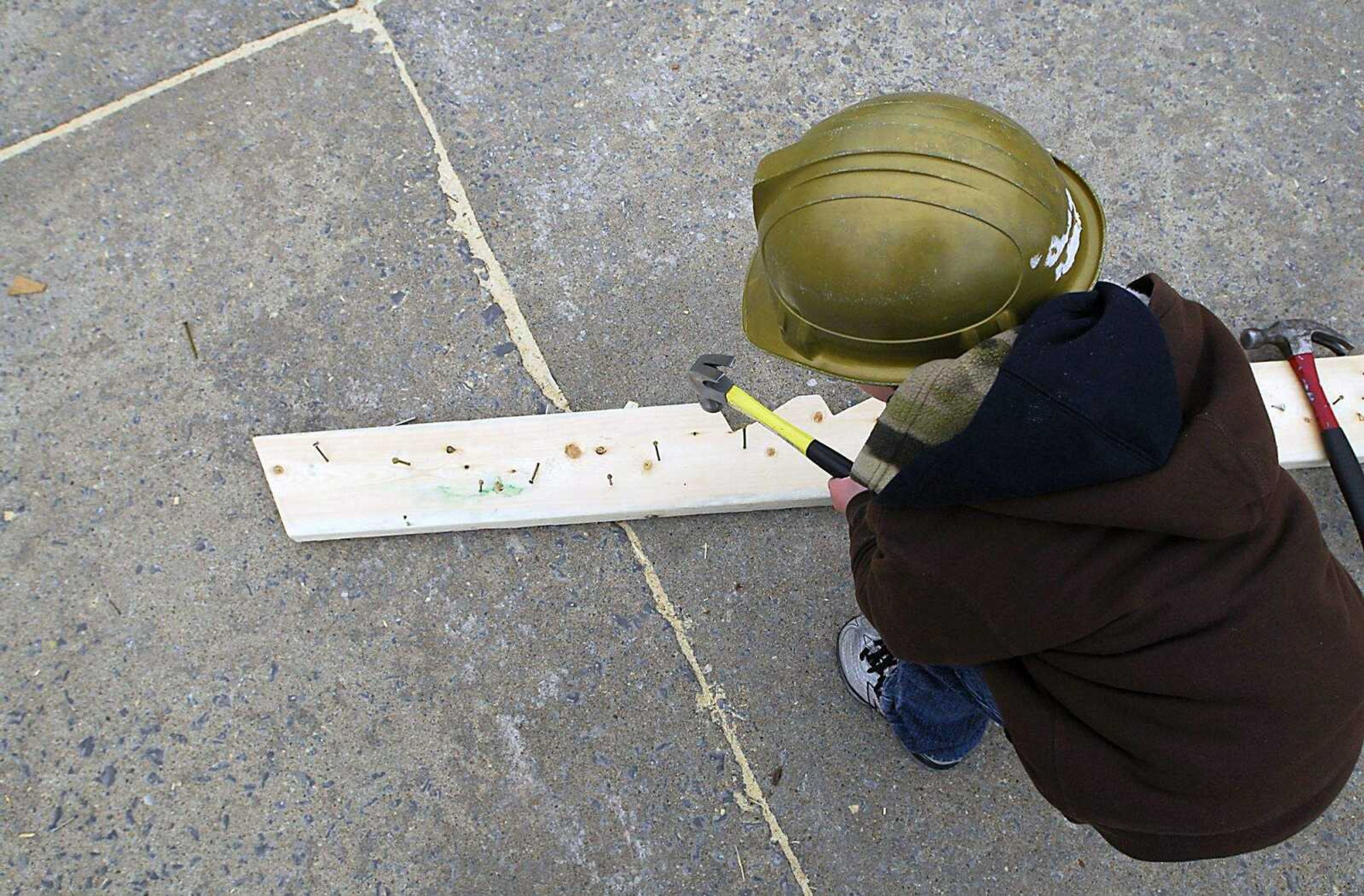 KIT DOYLE ~ kdoyle@semissourian.com
Jacob Asendorf, 4, practices hammering at the Habitat for Humanity home being built in the Alumni Center parking lot Thursday, March 12, 2009, in Cape Girardeau.