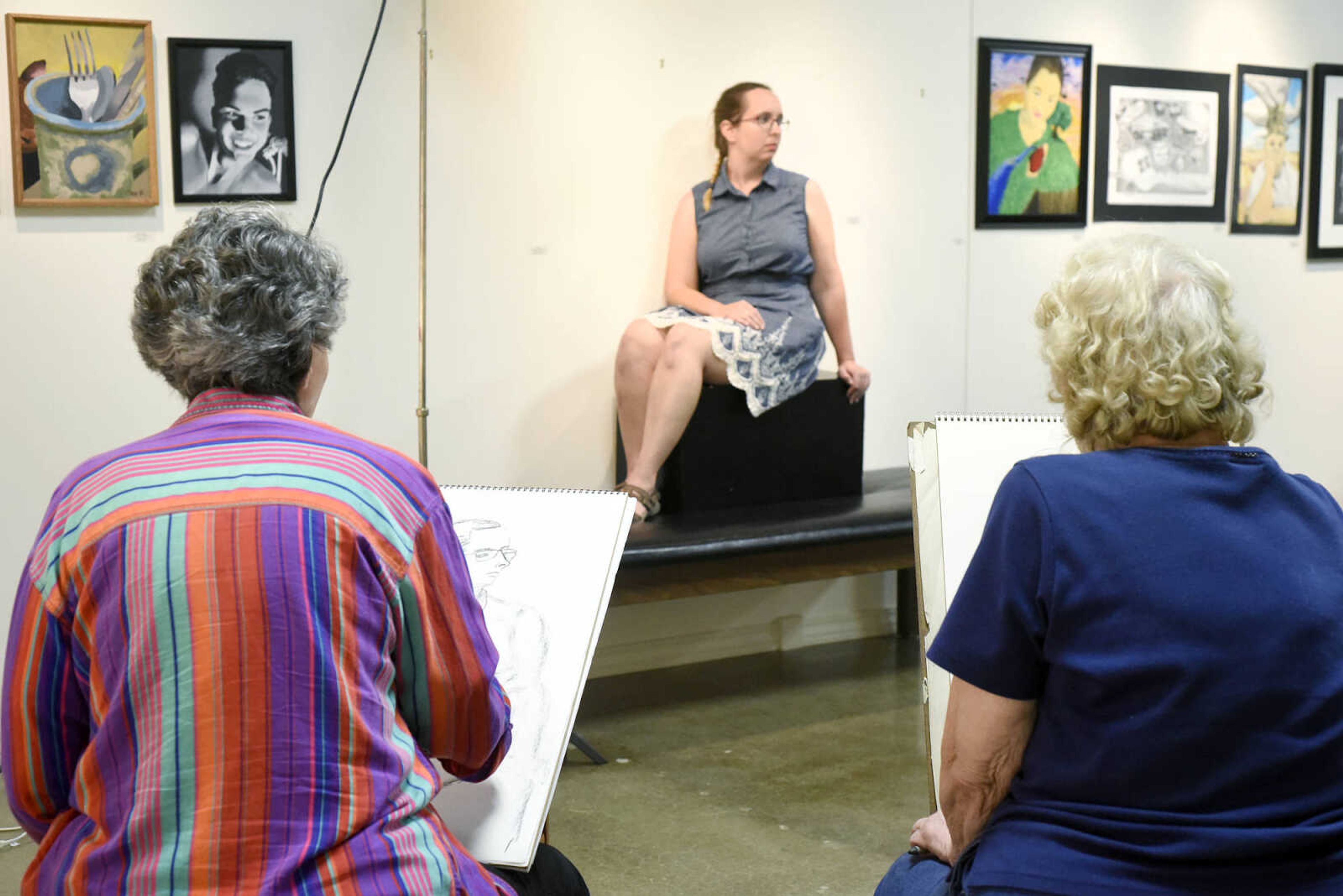 Brenda Seyer, left, and Anita Dickerson sketch Emily Seiler during the figure drawing session on Wednesday night, May 17, 2017, at the Arts Council of Southeast Missouri in downtown Cape Girardeau.