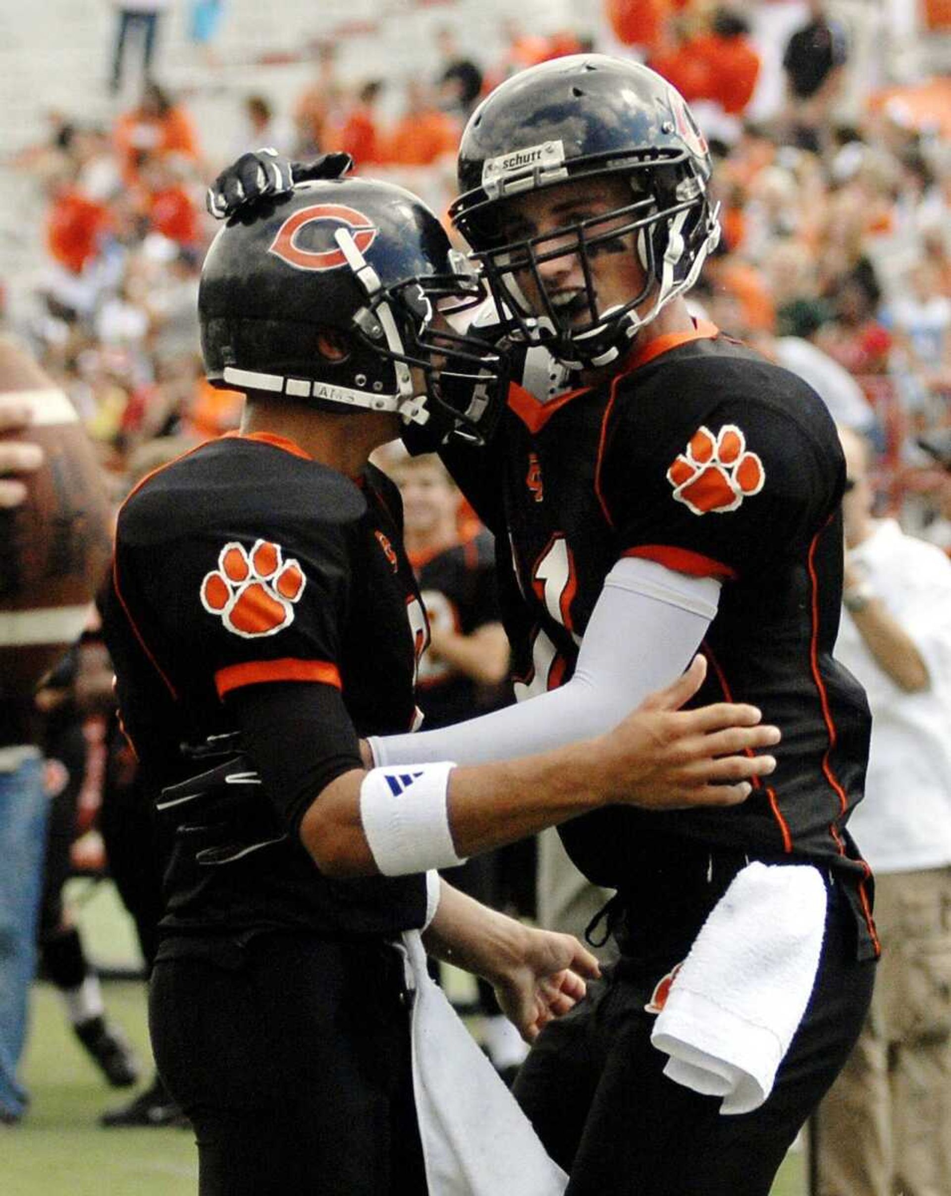 Central quarterback Christian Cavaness, left, and wide receiver Andrew Williams celebrate Cavaness' touchdown pass to Williams during Saturday's game.