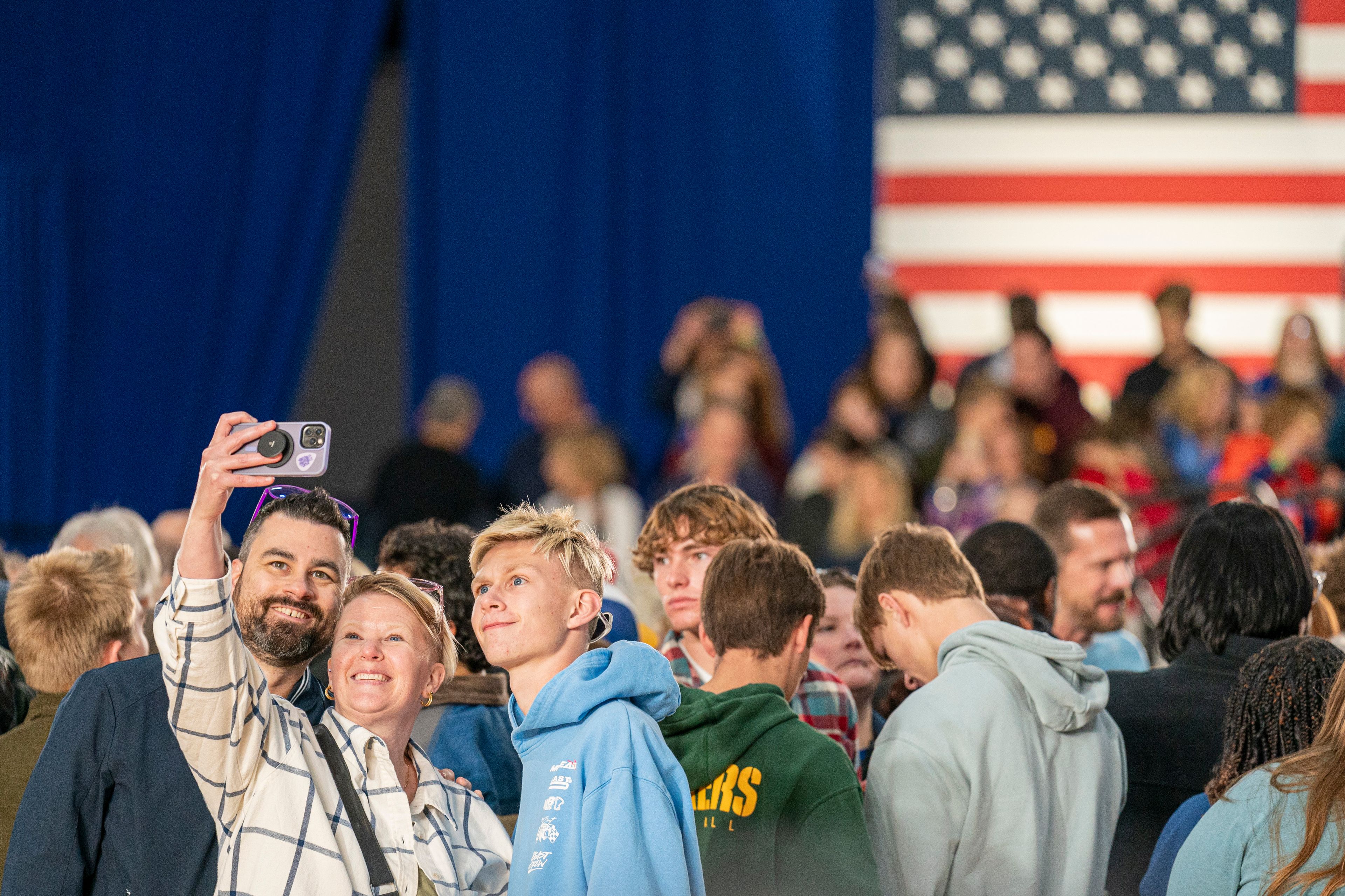 Supporters take a selfie before Democratic presidential nominee Vice President Kamala Harris speaks at a campaign event Friday, Nov. 1, 2024, in Little Chute, Wis. (AP Photo/Andy Manis)