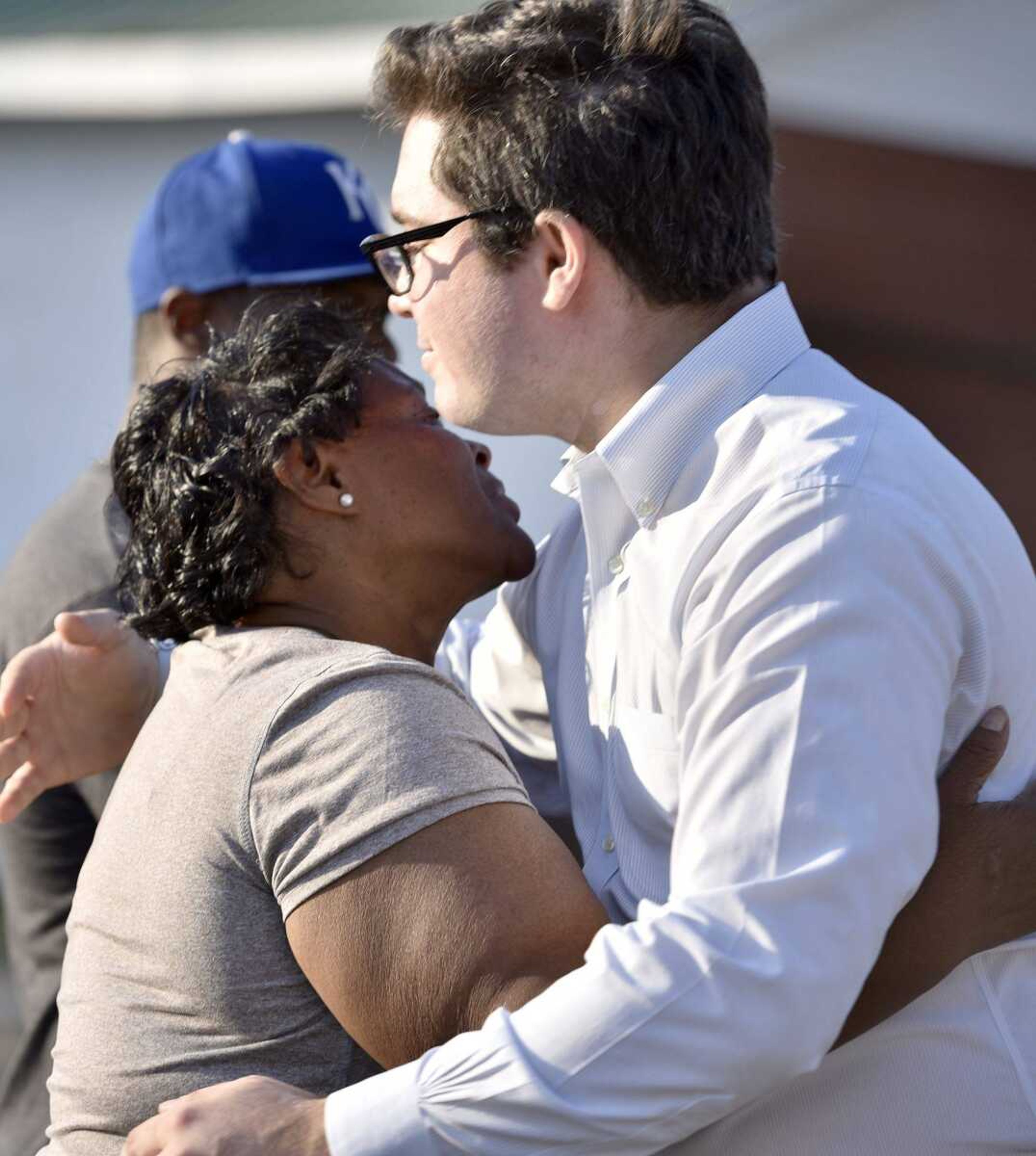 Jonathan Potts, one of David Robinson's attorneys, hugs Robinson's mother, Jennett McCaster, after meeting with her and her family in Sikeston, Missouri in October.