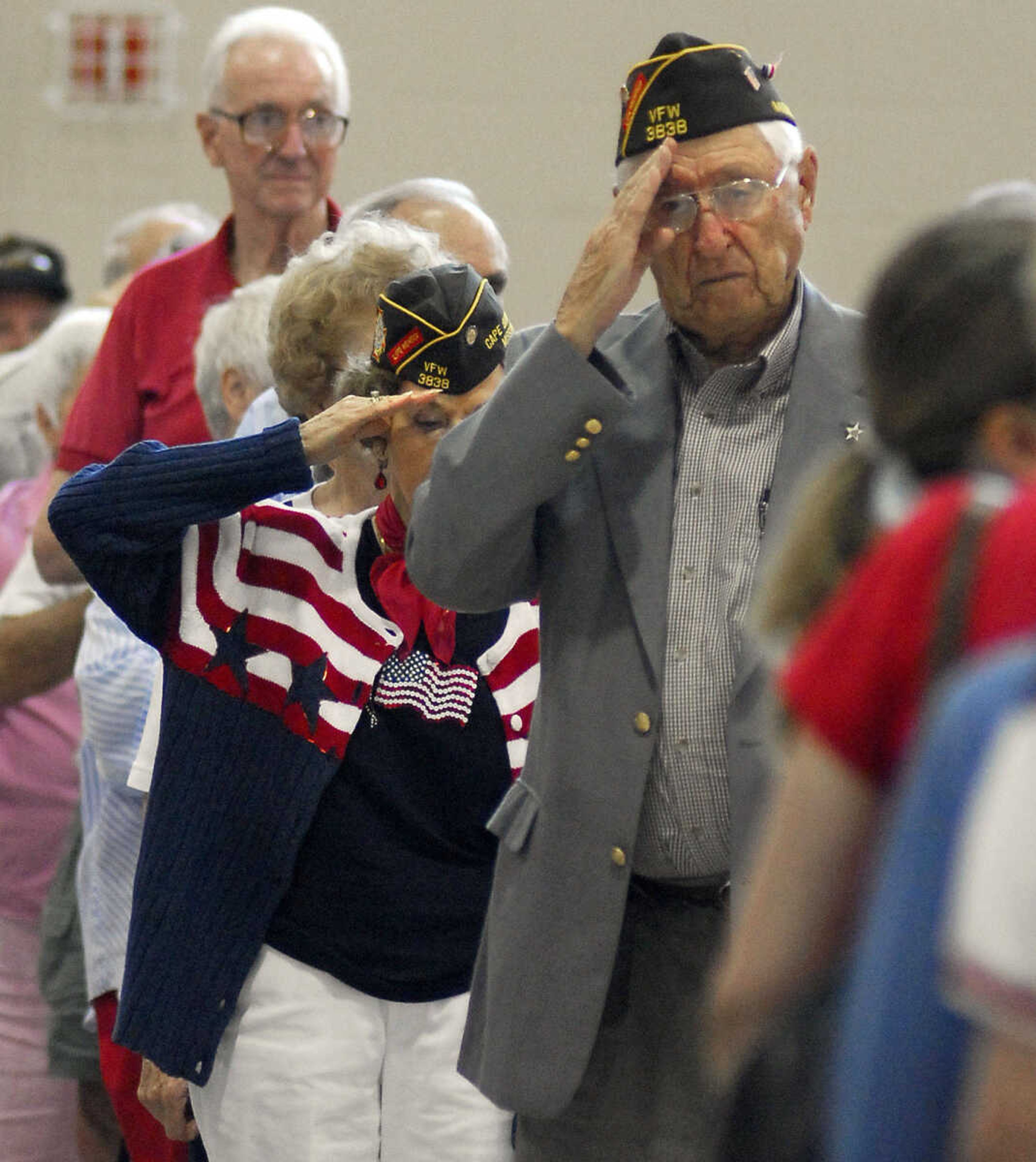 LAURA SIMON~lsimon@semissourian.com
Veterans salute as the color guard approaches Monday, May 31, 2010 during the Memorial Day Program at the Osage Community Centre.