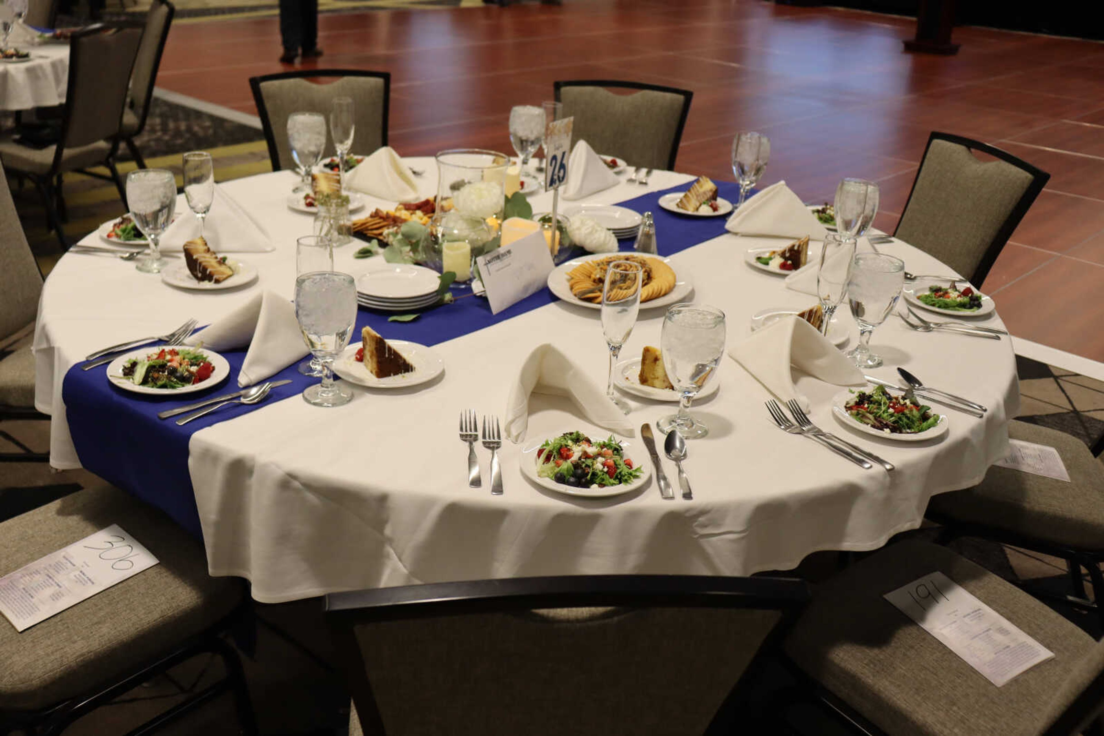 The table of food has been set and is waiting for the incoming people.