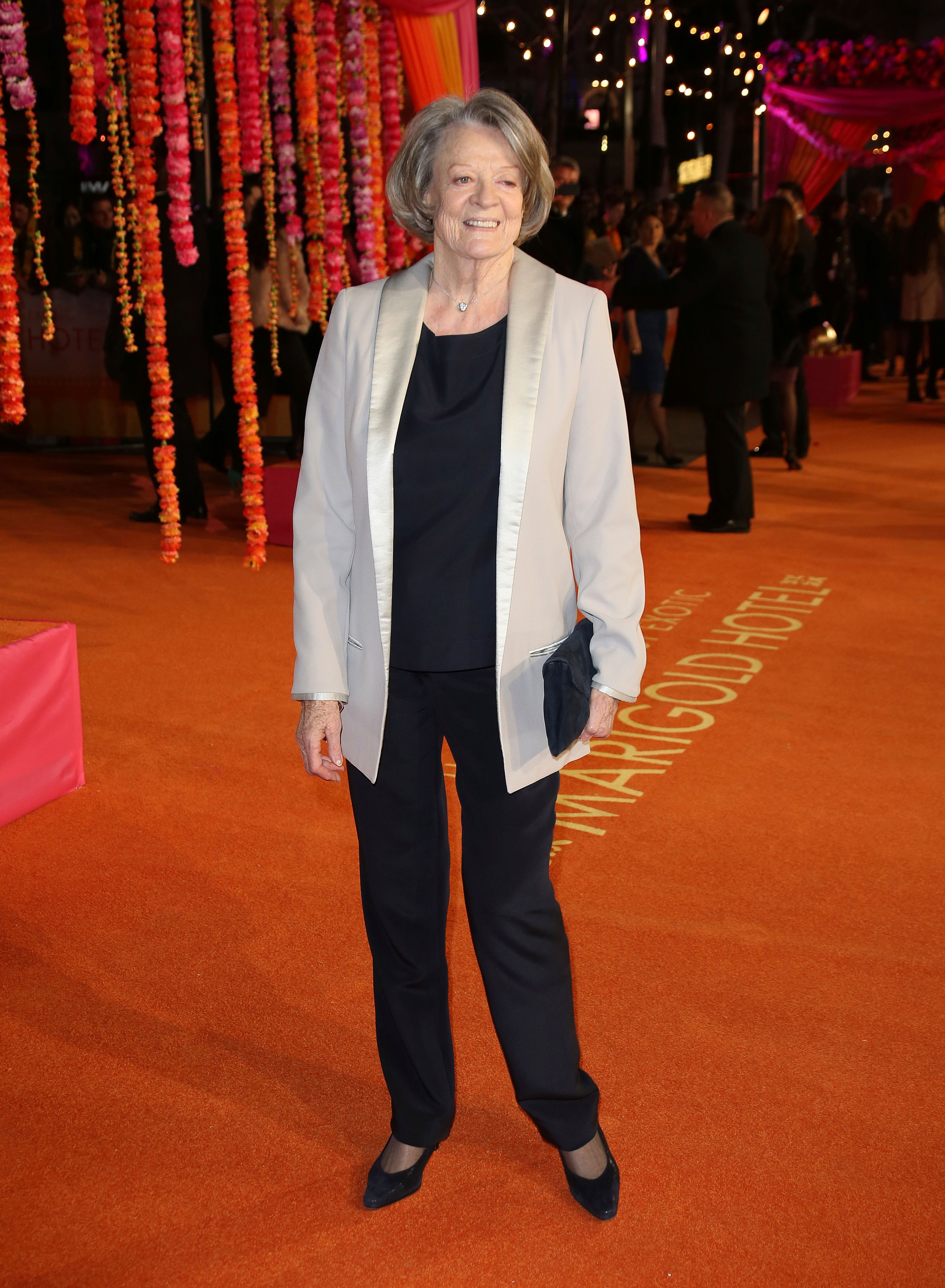 FILE - ACtress Maggie Smith appears at the World Premiere of "The Second Best Exotic Marigold Hotel" at a central London cinema in Leicester Square, on Feb. 17, 2015. Smith, who won an Oscar for “The Prime of Miss Jean Brodie” in 1969 and won new fans in the 21st century as the dowager Countess of Grantham in “Downton Abbey,” has died at 89. (Photo by Joel Ryan/Invision/AP, File)