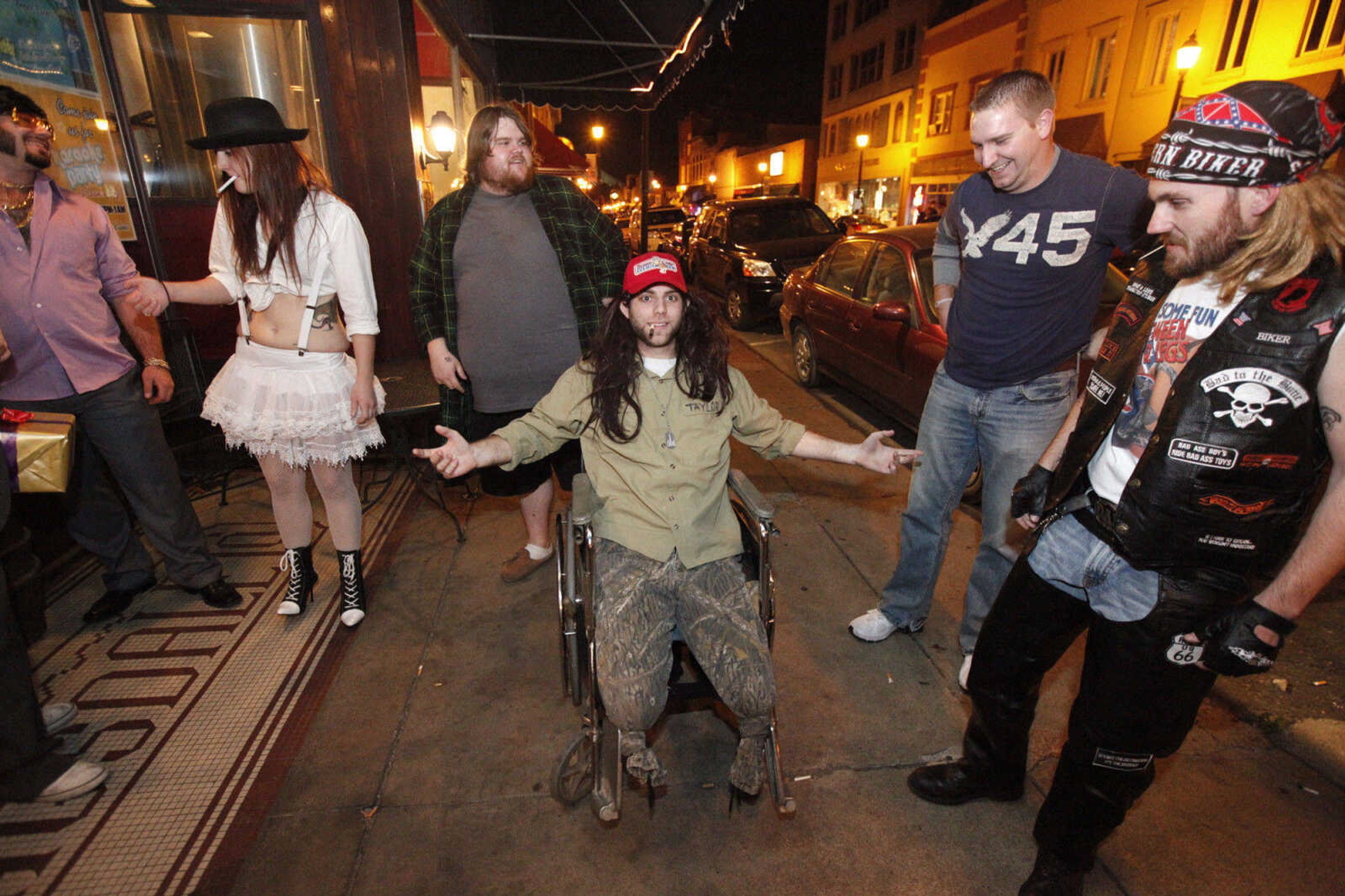 CHRIS MACKLER ~ photos@semissourian.com

Costumed partygoers  outside of Buckner Brewing Company in Cape Girardeau on Saturday, Oct. 30, 2010.