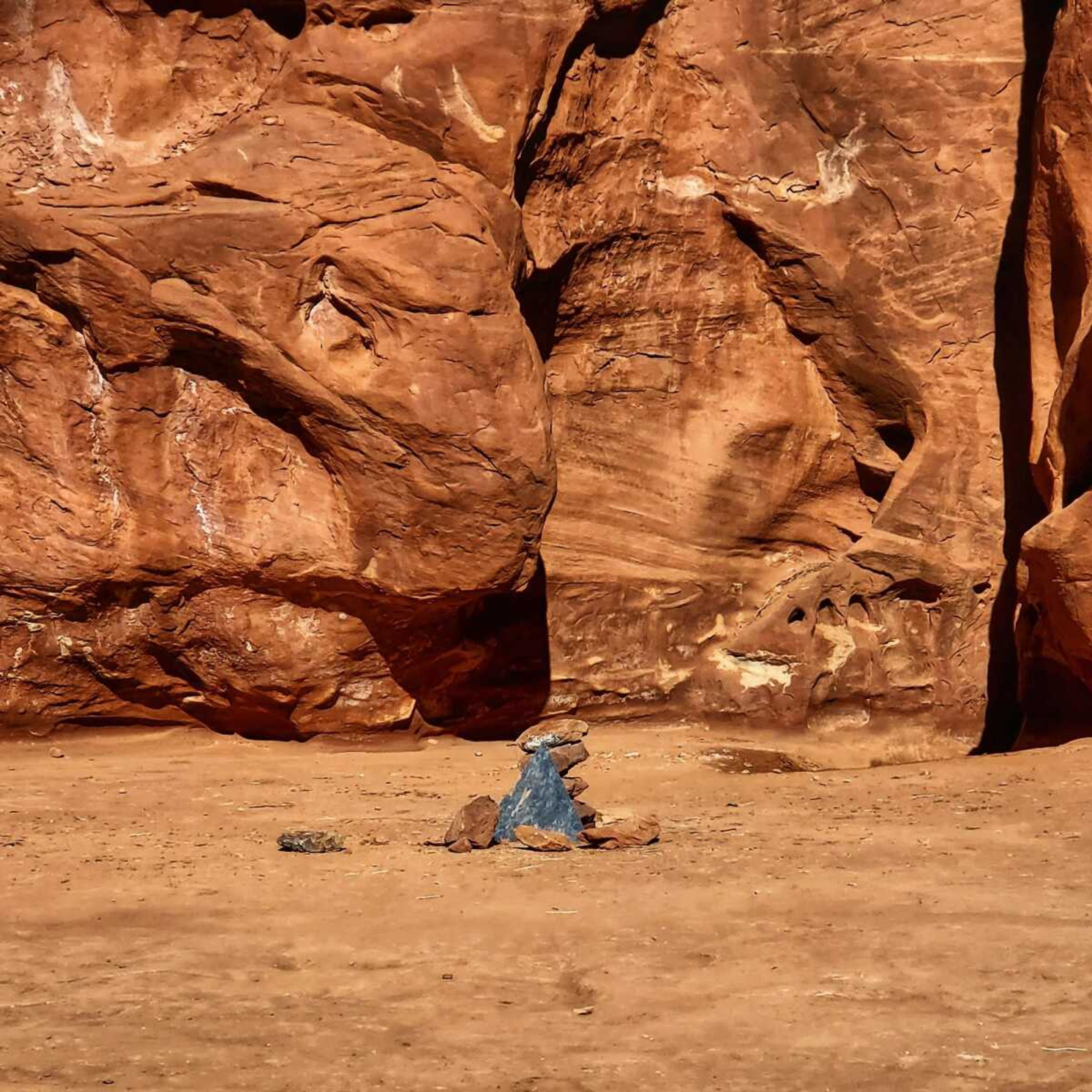 Rocks mark the location Saturday where a metal monolith once stood in the ground in a remote area of red rock in Spanish Valley, Utah, south of Moab near Canyonlands National Park.