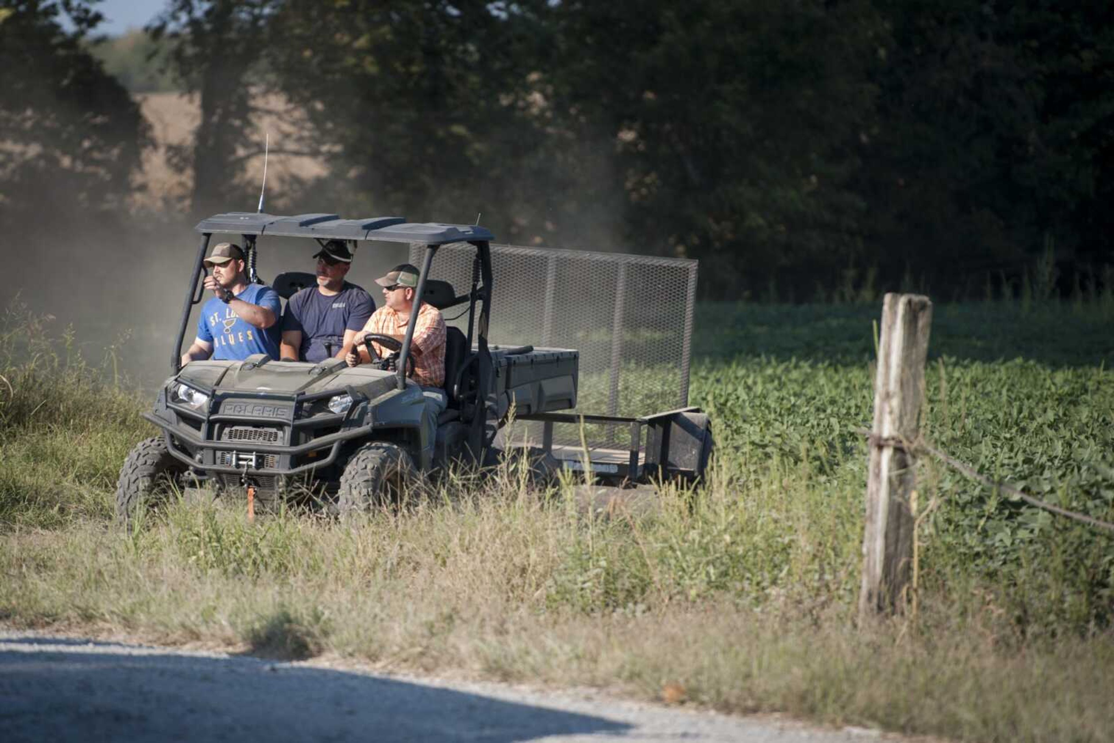 Members of the Scott County Sheriffs Department and FBI agents investigate a property along County Road 329 on Monday near Benton, Missouri.