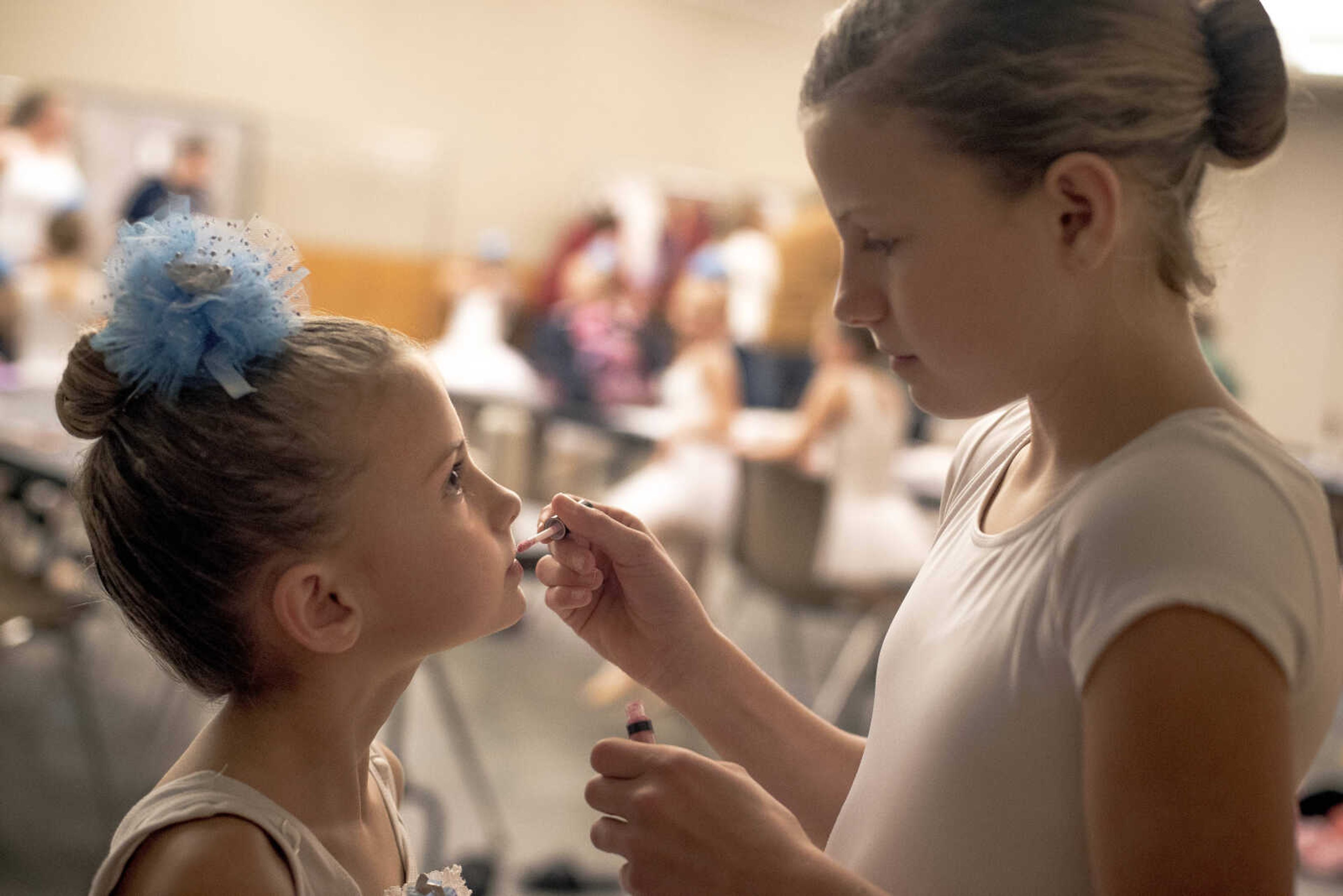 Elayna Perkins, left, dressed in a snowflake costume, gets makeup help from Ava Jones, right, before performing with the Moscow Ballet on Tuesday, Dec. 10, 2019, at the Southeast Missouri State University River Campus in Cape Girardeau. 
Elayna Perkins