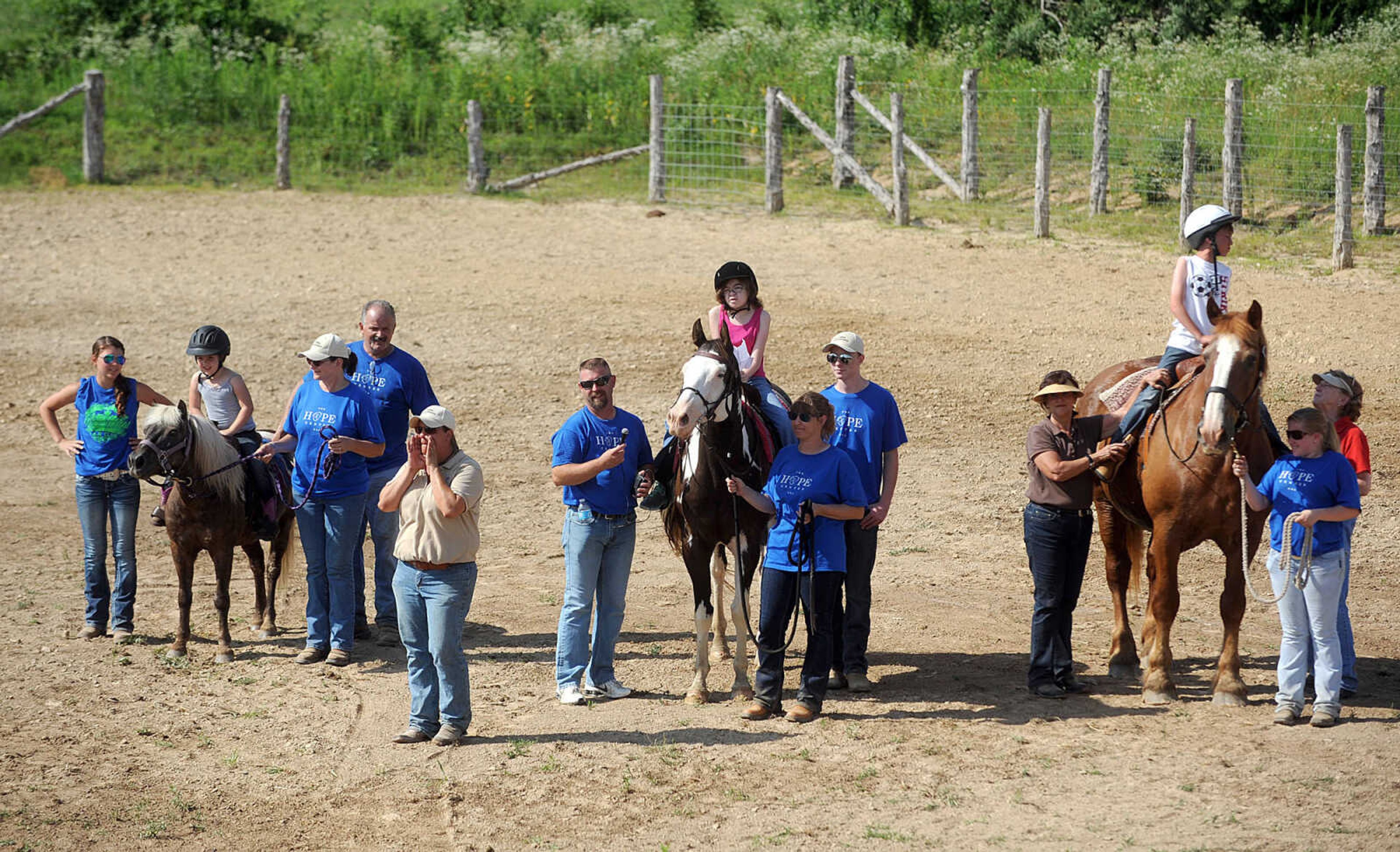 LAURA SIMON ~ lsimon@semissourian.com

Hope Hudson welcomes visitors and the Budweiser Clydesdales to the The Hope Theraputic Horsemanship Center in Perryville, Missouri, Friday, June 20, 2014.