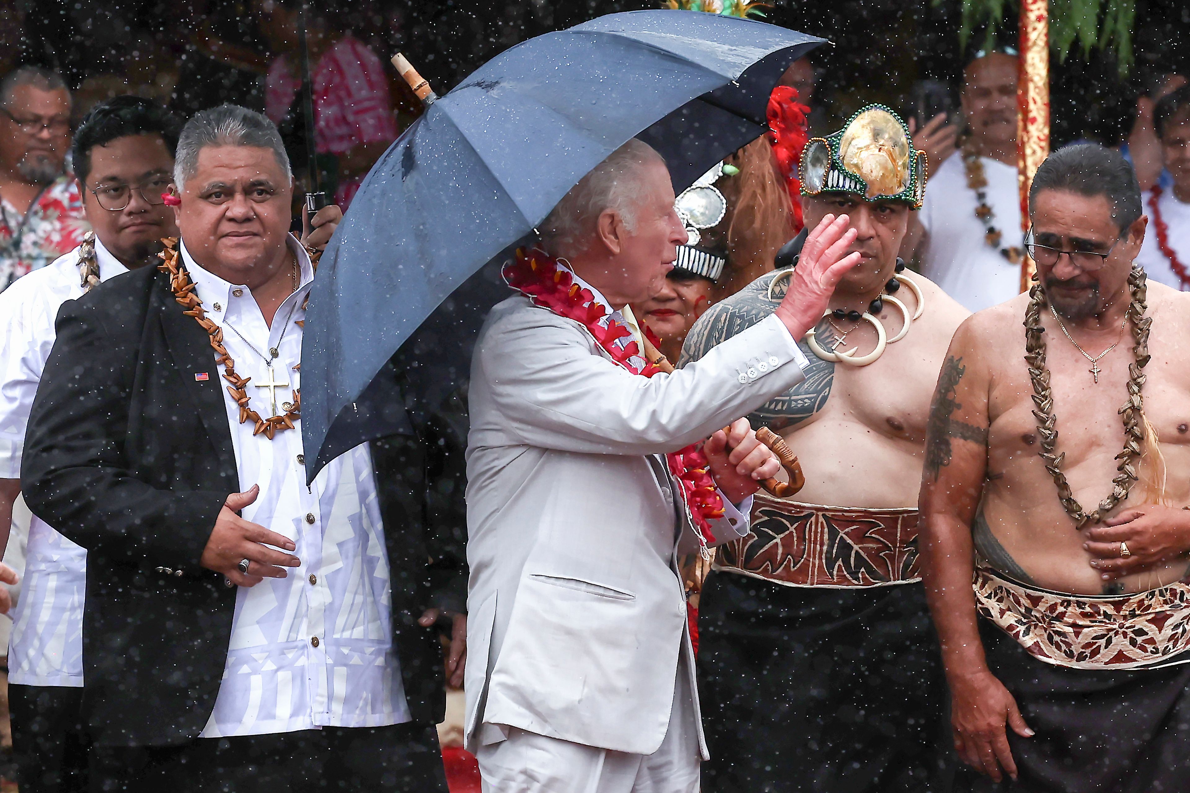 Britain's King Charles III waves as he departs after the bestowing and farewell ceremony on the final day of the royal visit to Samoa at the Siumu Village in Apia, Samoa, Saturday, Oct. 26, 2024. (Manaui Faulalo/Pool Photo via AP)