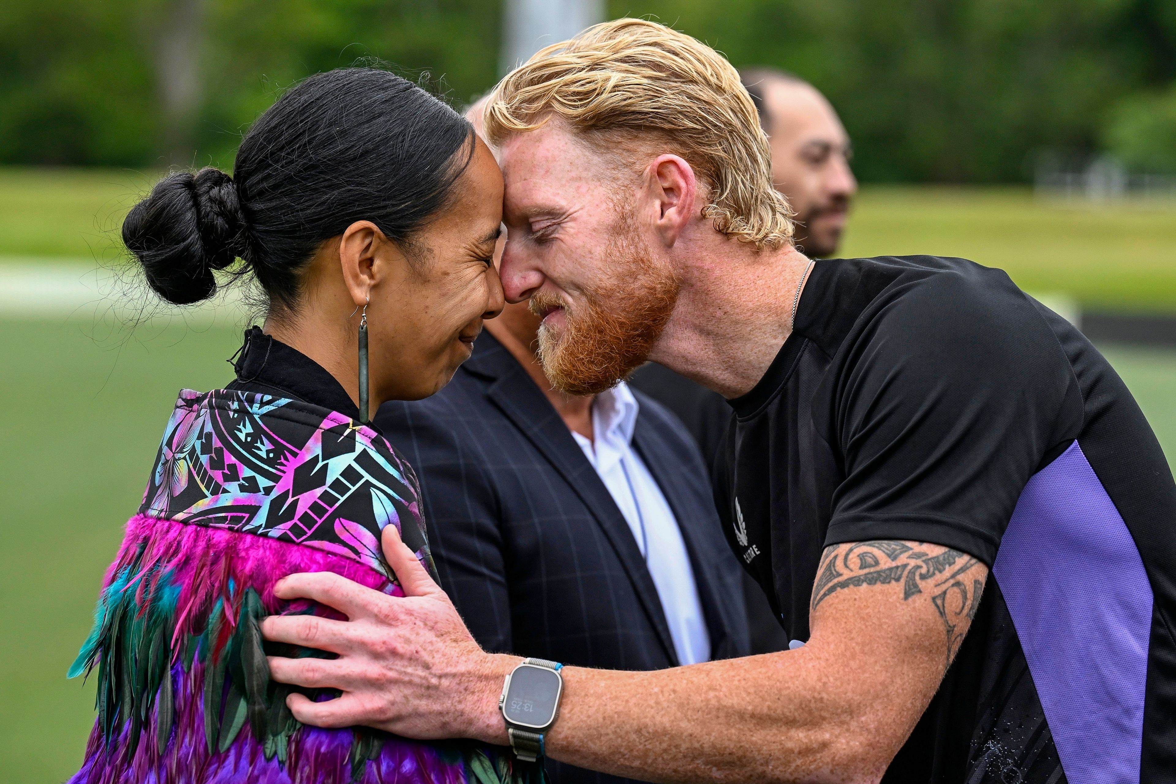 England cricket captain Ben Stokes performs a hongi at the Mihi Whakatau, a traditional teams welcome, on the field at Hagley Oval, ahead of the first cricket test against New Zealand in Christchurch, New Zealand, Tuesday, Nov. 26, 2024. (Andrew Cornaga/Photosport via AP)