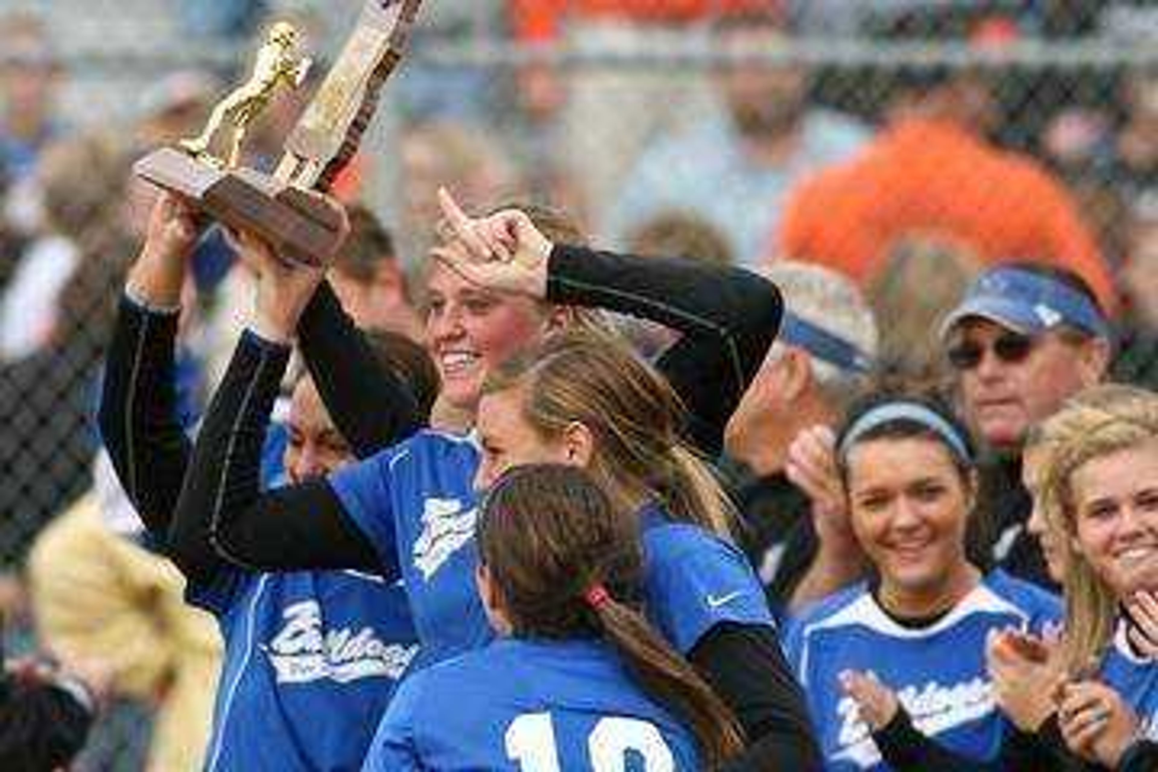 Notre Dame Bulldogs players react after receiving the Class 3 Championship trophy during the MSHSAA State Softball Championship game in St. Joseph. The Bulldogs defeated the Kirksville 3-0. Photo: Tyson Hofsommer