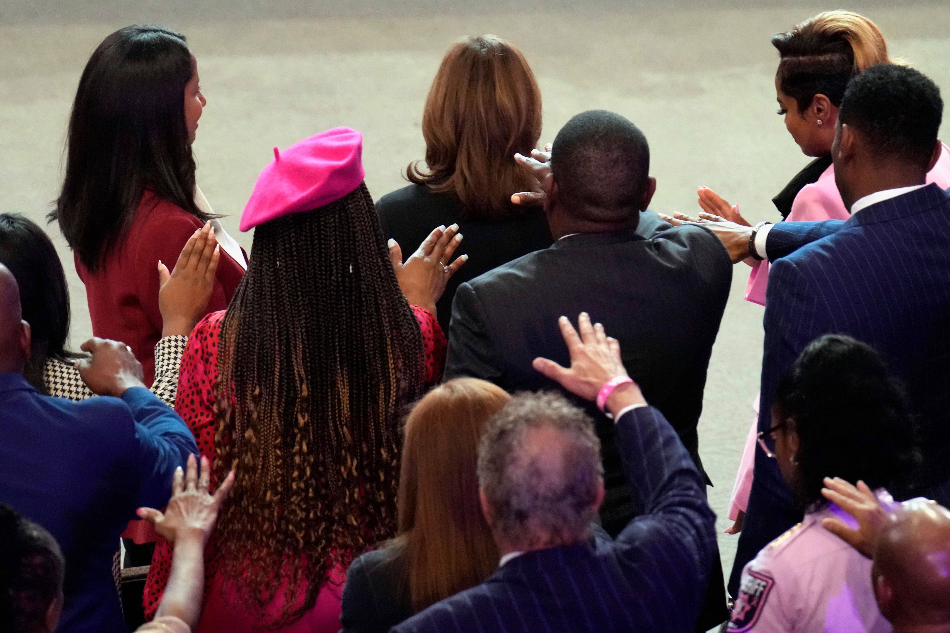 The congregation prays for Democratic presidential nominee Vice President Kamala Harris, top center, at a church service at New Birth Baptist Church in Stonecrest, Ga., Sunday, Oct. 20, 2024. (AP Photo/Jacquelyn Martin)