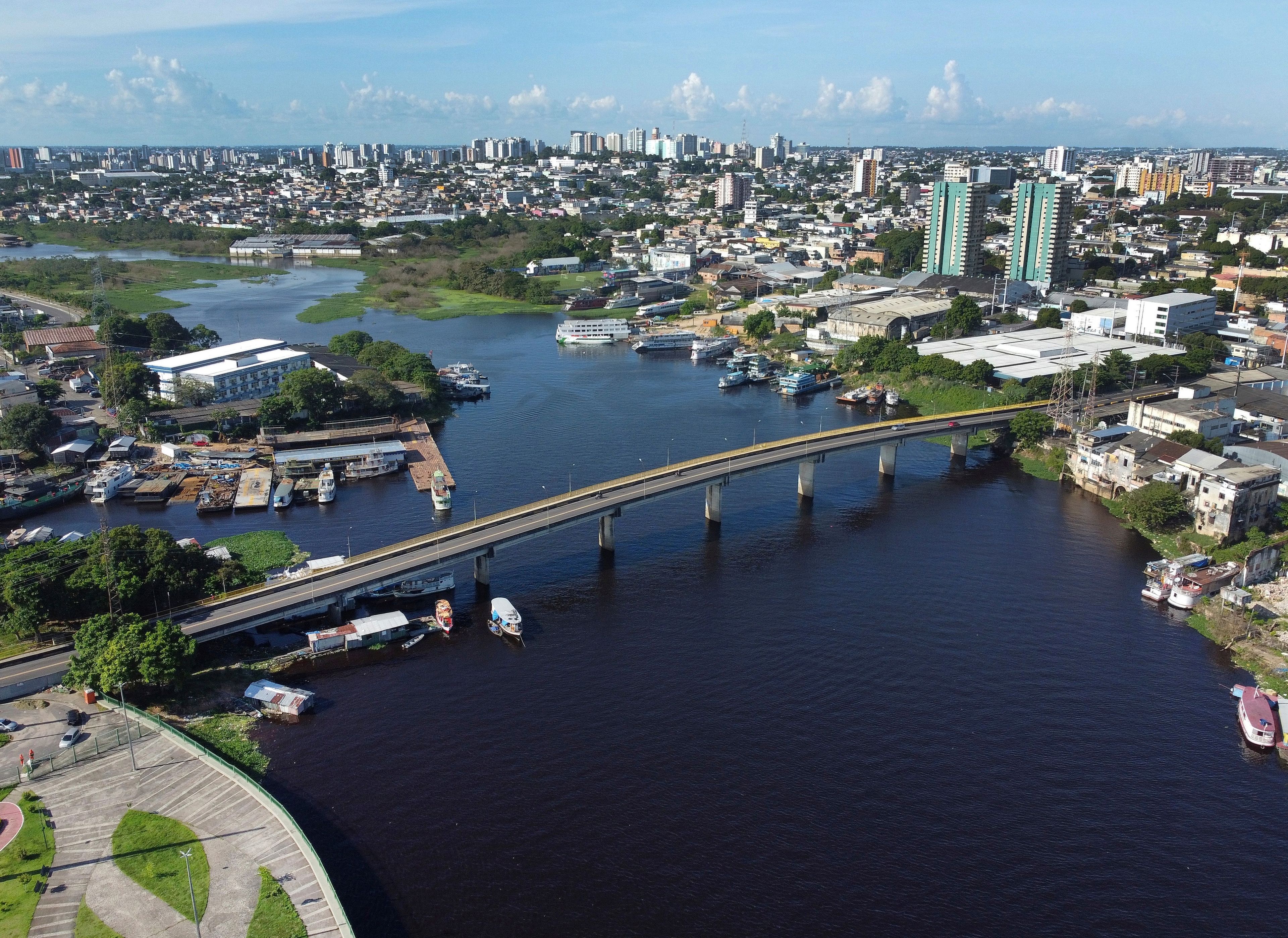 Part of the Sao Raimundo that connects to the Negro River is visible in Manaus, state of Amazonas, Brazil, Thursday, June 20, 2024. (AP Photo/Edmar Barros)