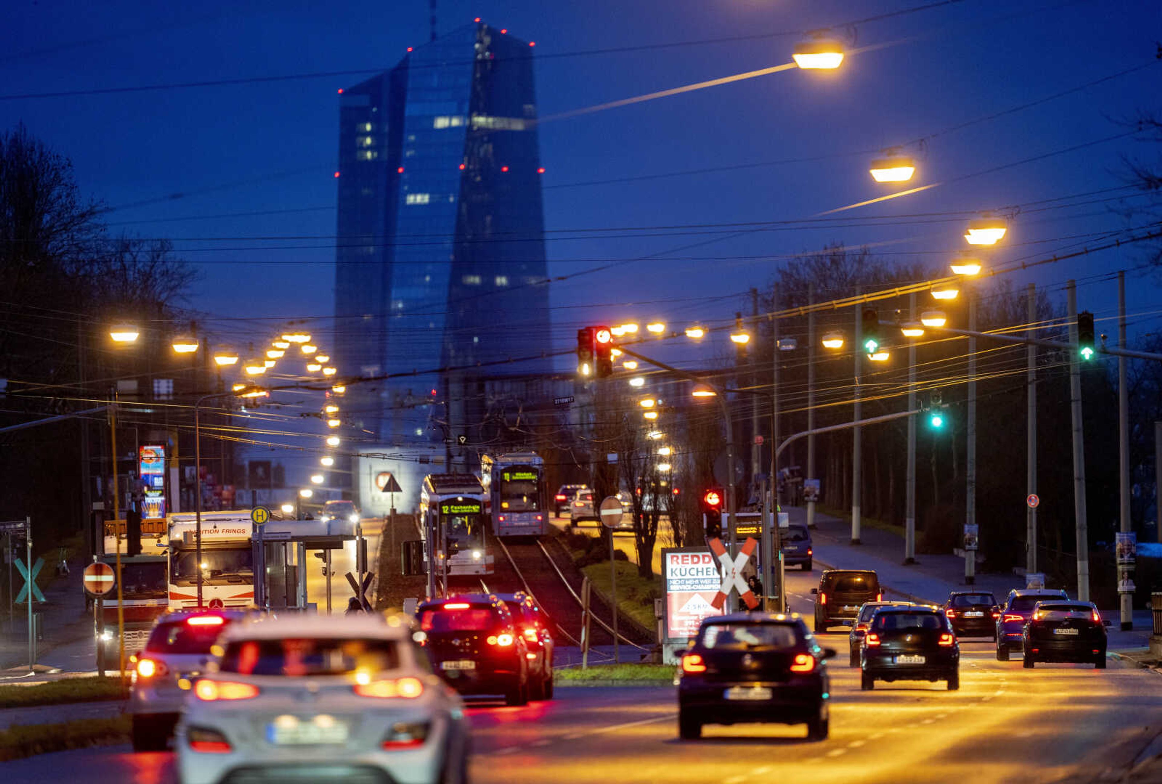 People drive toward the city of Frankfurt, Germany, on Feb. 3. The European Central Bank appears at center, rear.