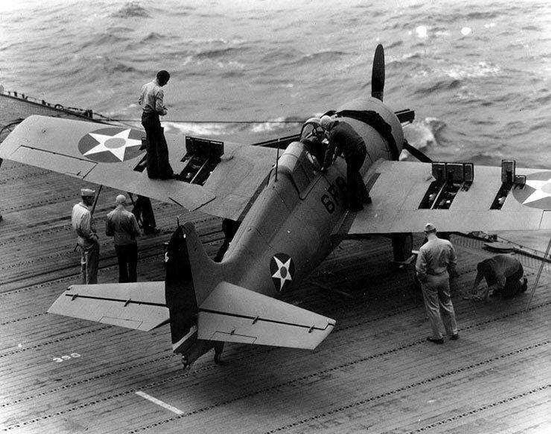 A Grumman F4F-4 Wildcat fighter has its six .50 caliber machine guns tested on the flight deck of the U.S.S. Enterprise on April 10, 1942. (Photo courtesy of the 100th Anniversary of Naval Aviation Foundation)