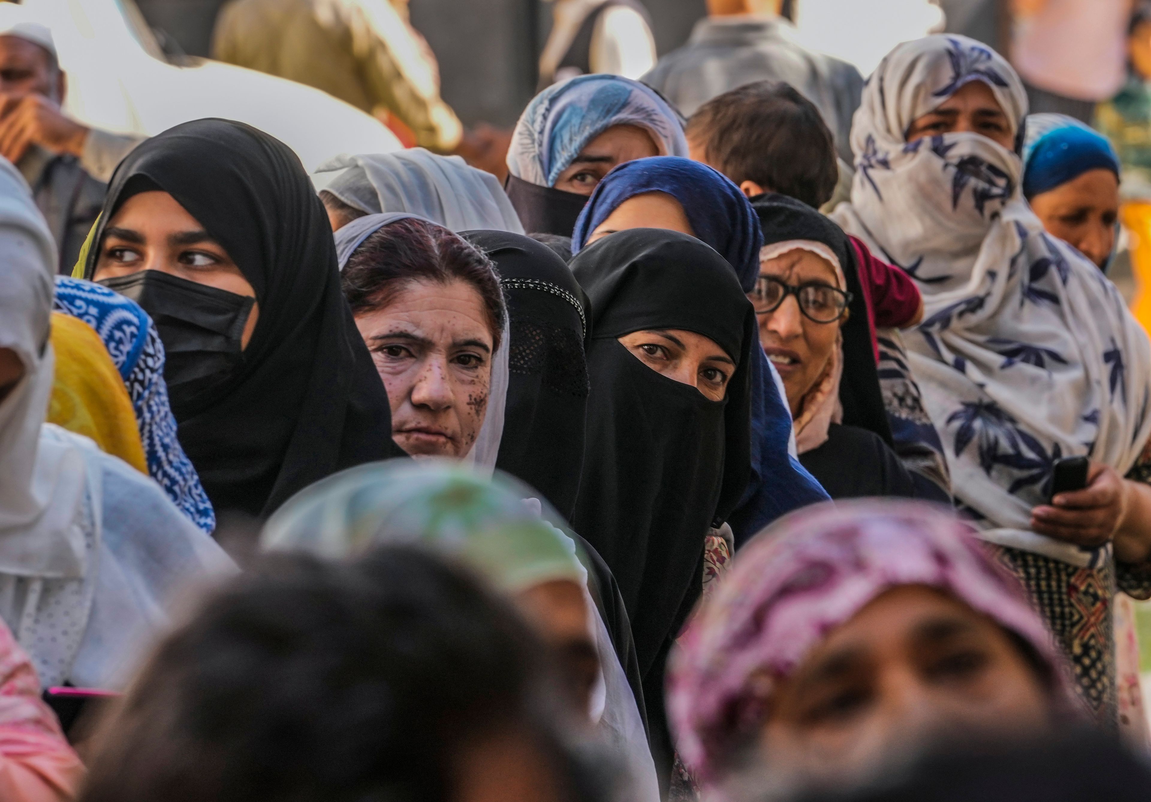 Kashmiri women queue up at a polling booth to cast their vote during the final phase of an election to choose a local government in Indian-controlled Kashmir, north of Srinagar, Tuesday, Oct.1, 2024. (AP Photo/Mukhtar Khan)