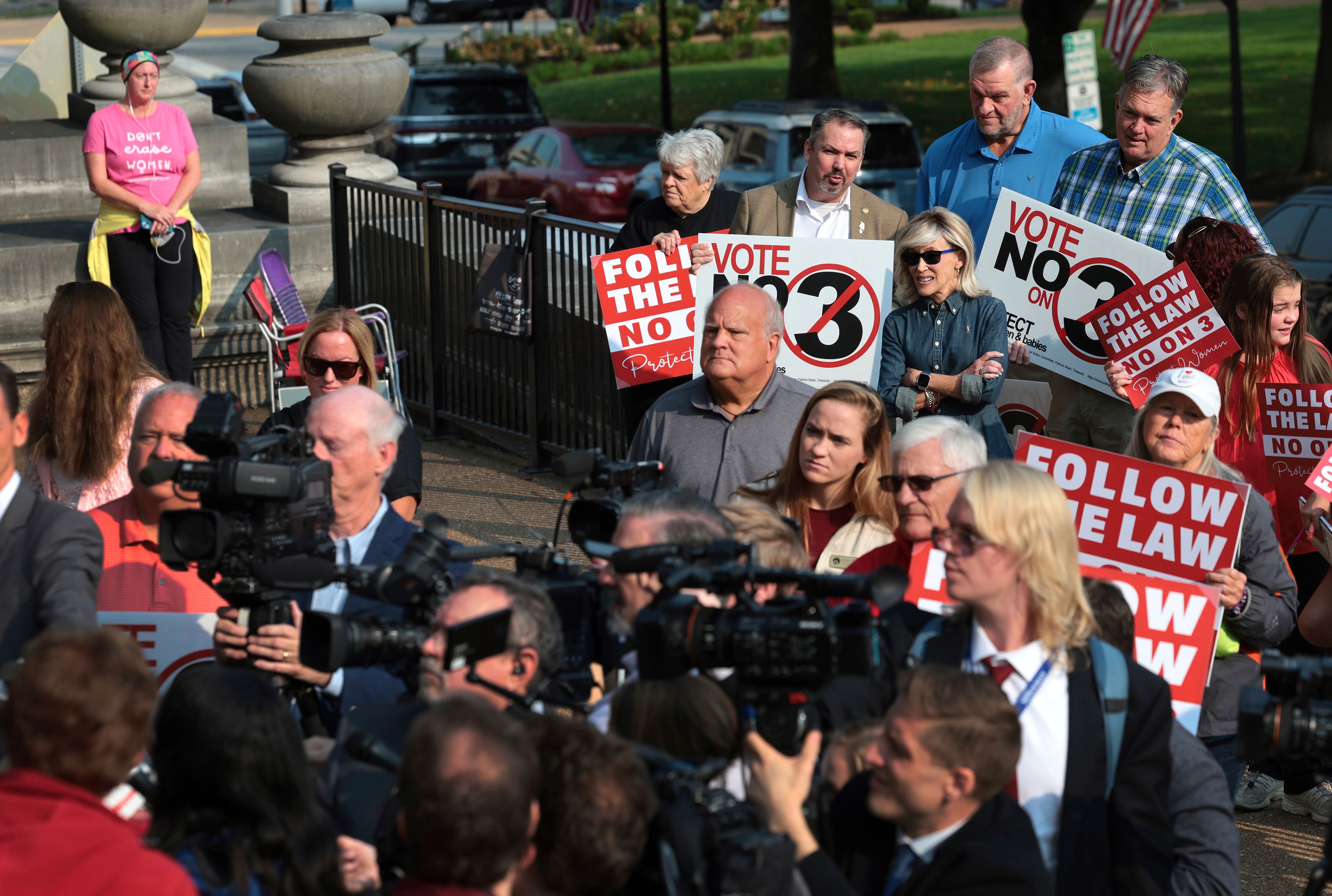 FILE - Abortion opponents watch and pray as members of the media interview attorney Mary Catherine Martin of the conservative Thomas More Society, after Missouri's Supreme Court heard arguments over whether an abortion-rights amendment should go before voters this year on Sept. 10, 2024 in Jefferson City, Mo. (Robert Cohen/St. Louis Post-Dispatch via AP, File)