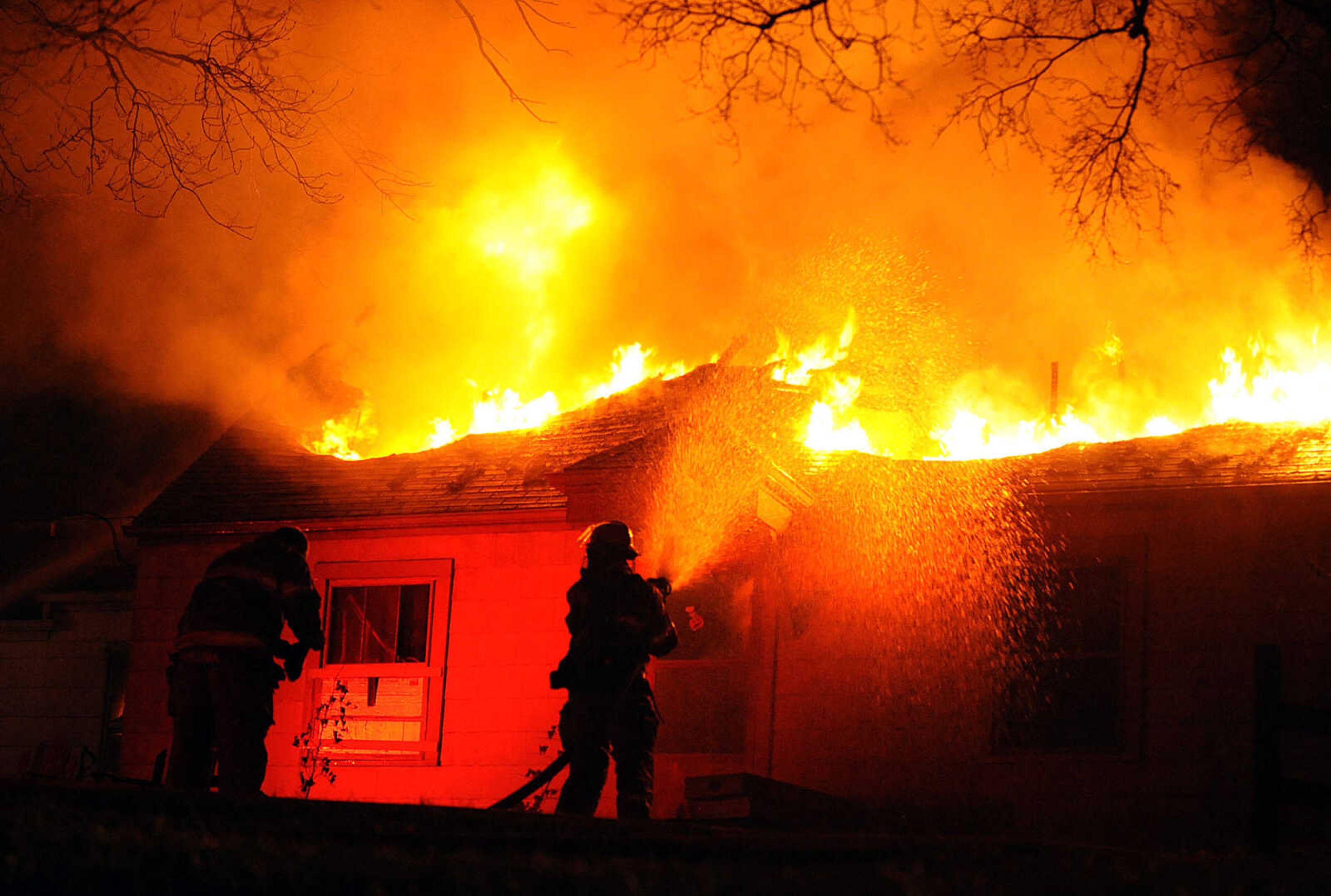 LAURA SIMON ~ lsimon@semissourian.com
Firefighters from Delta, Gordonville, Cape Girardeau, Millersville, Fruitland and East County Fire Departments battle a structure fire Wednesday night, January 9, 2012 on Onyx Lane in Cape Girardeau.