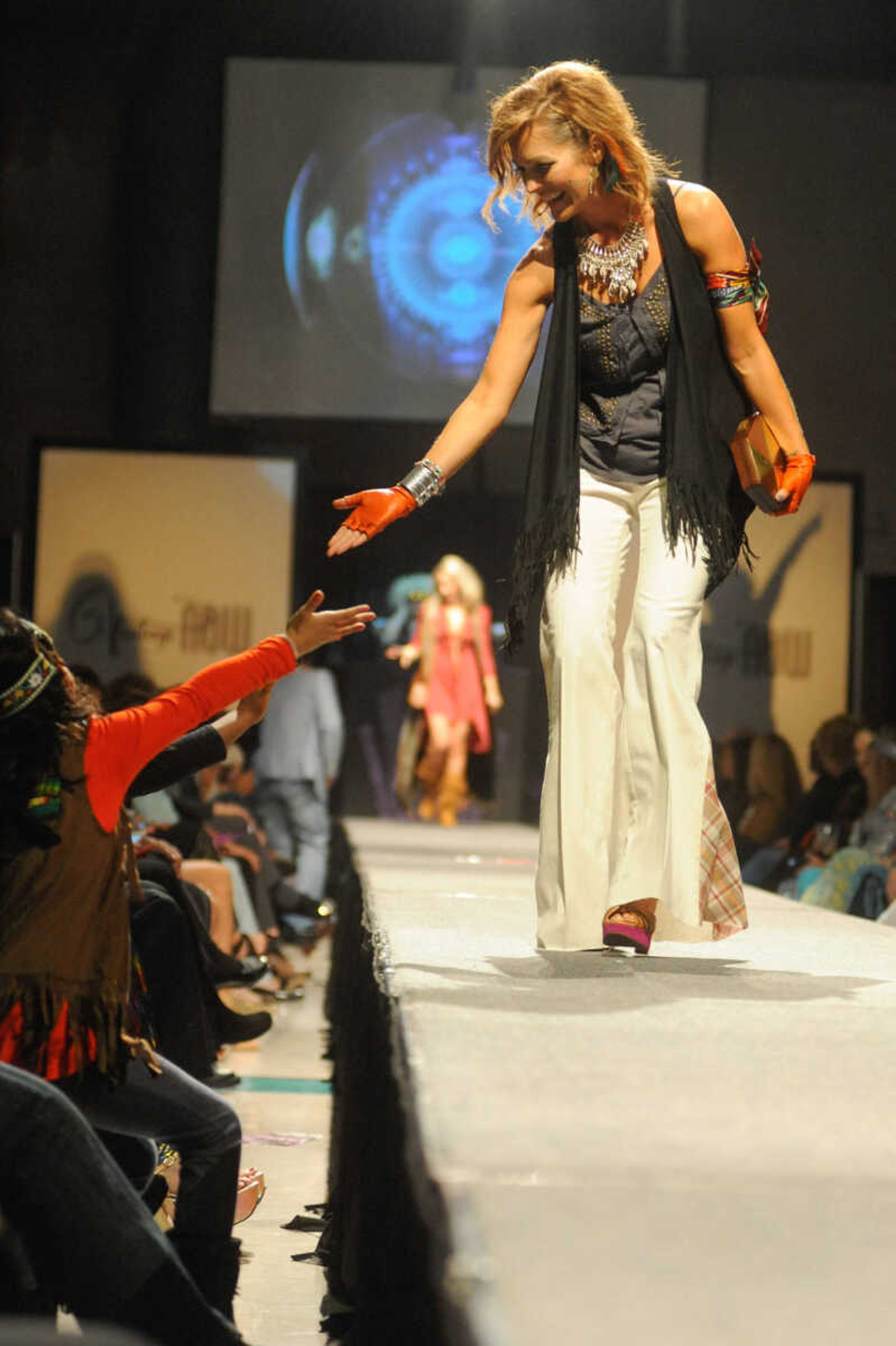 GLENN LANDBERG ~ glandberg@semissourian.com


Models make their way down the runway during the VintageNOW fashion show at the Osage Centre on Saturday, October 24, 2015. Proceeds benefited the Safe House for Women.