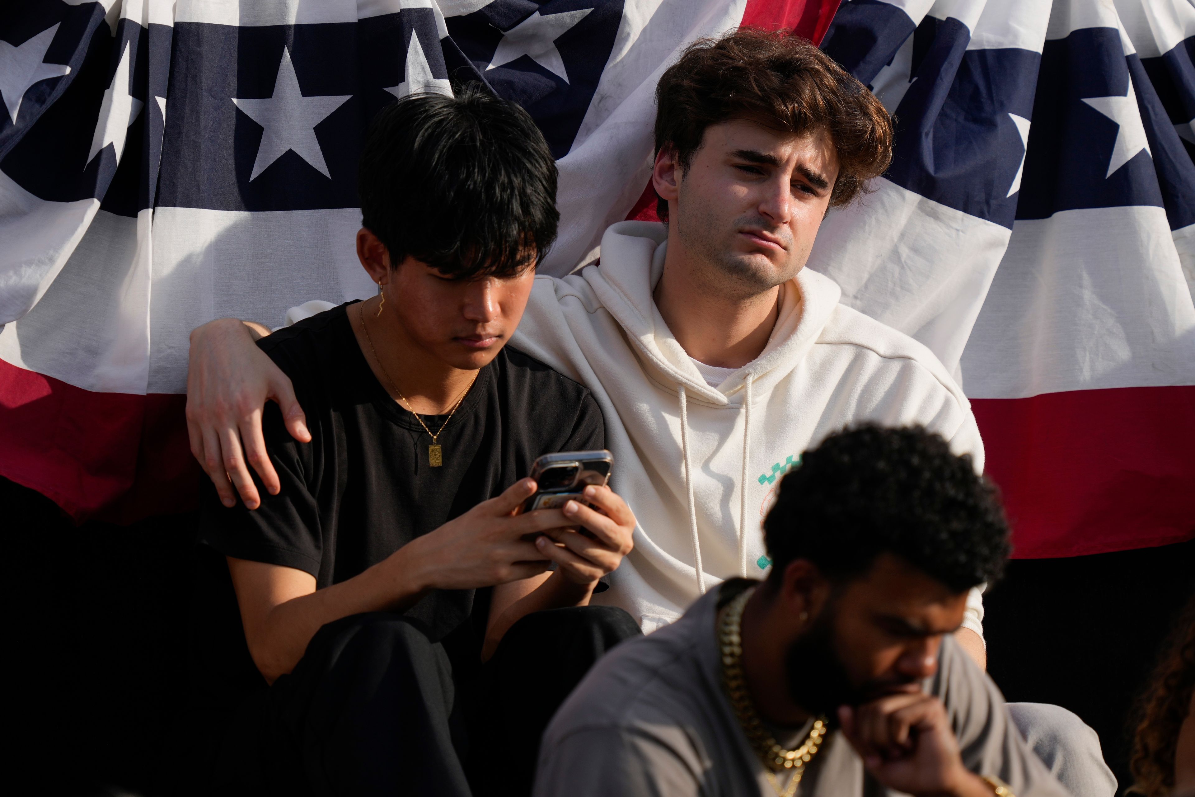 Supporters wait for Vice President Kamala Harris to arrive to deliver a concession speech for the 2024 presidential election on the campus of Howard University in Washington, Wednesday, Nov. 6, 2024. (AP Photo/Ben Curtis)